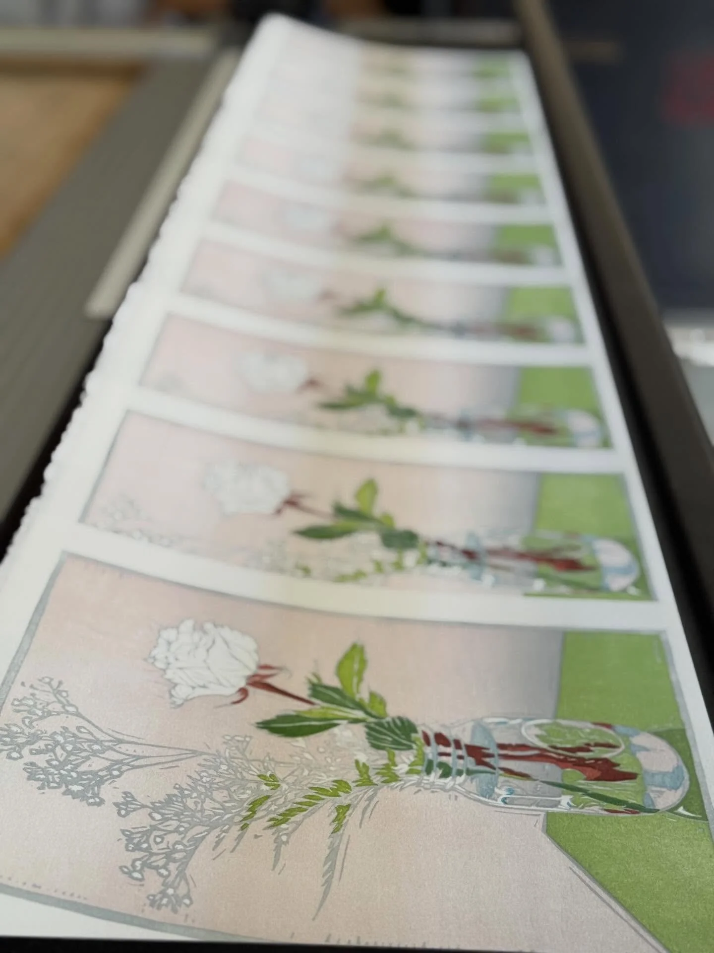 Prints are laid out to dry overnight. Printing one color a day, slowly adding to the whole. The image is coming to life. One step at a time.