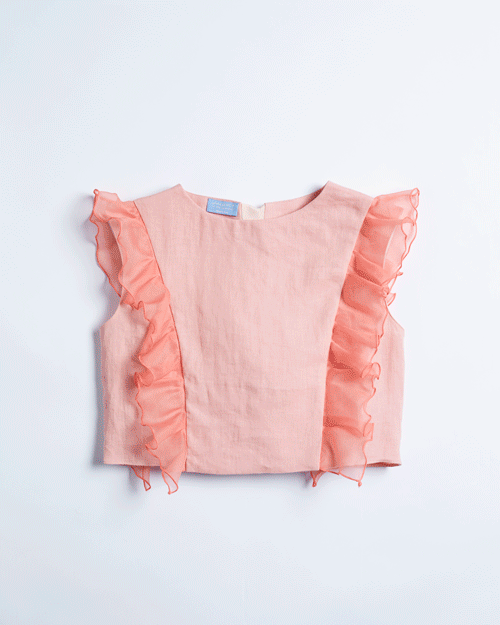 GIF of various Dreams in an Armoire Adelivia linen and silk organza tops on a white background.