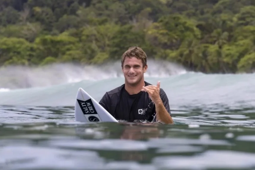 Surfer Benji Brand on board in water