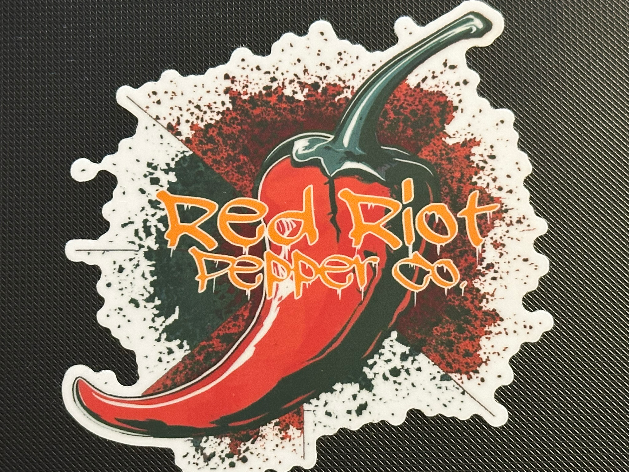 Red Riot Sticker on black.png