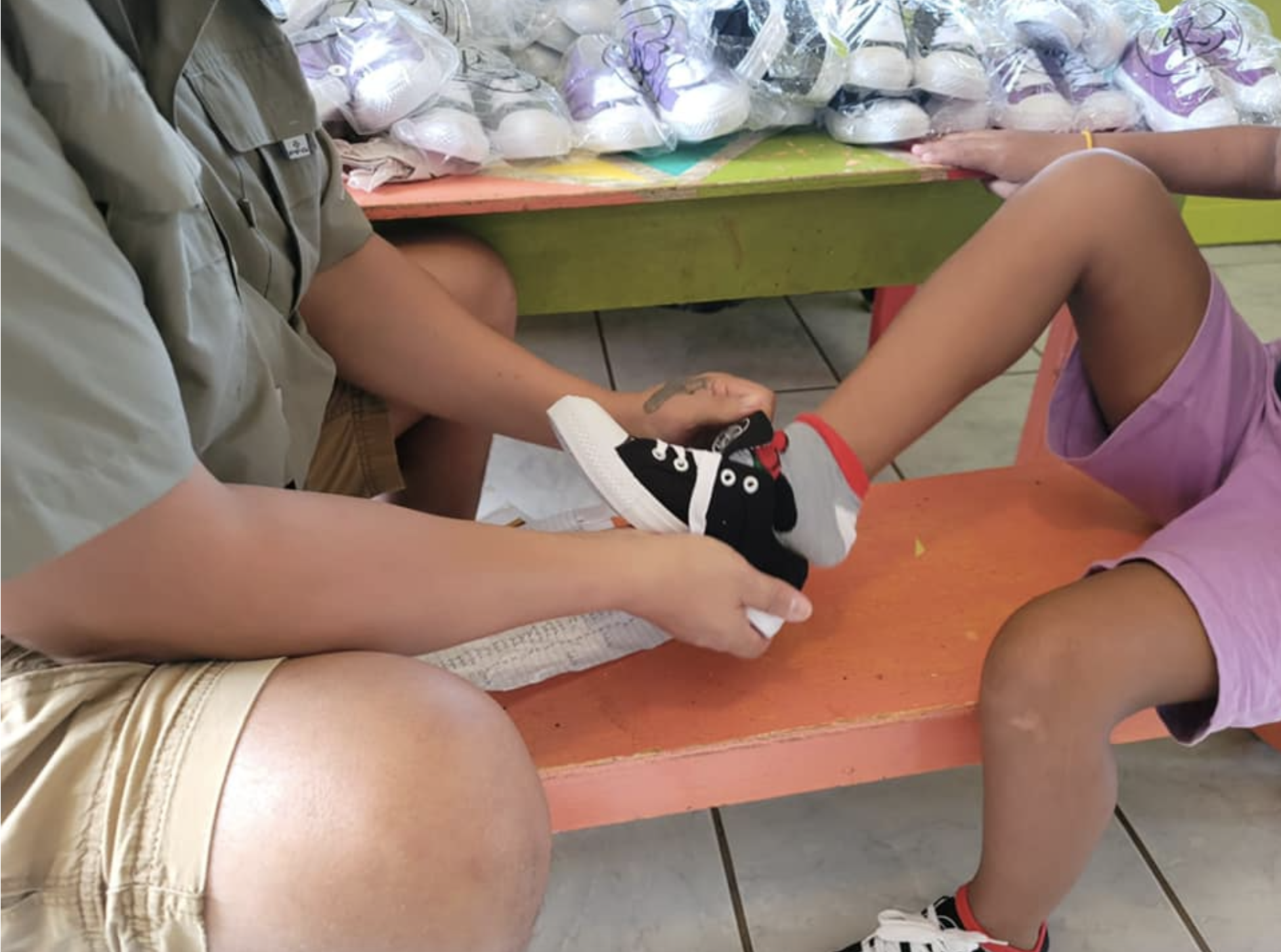 Children from the Liberty Children’s Home receiving shoes from Billy Lerner's Billy4Kids foundation