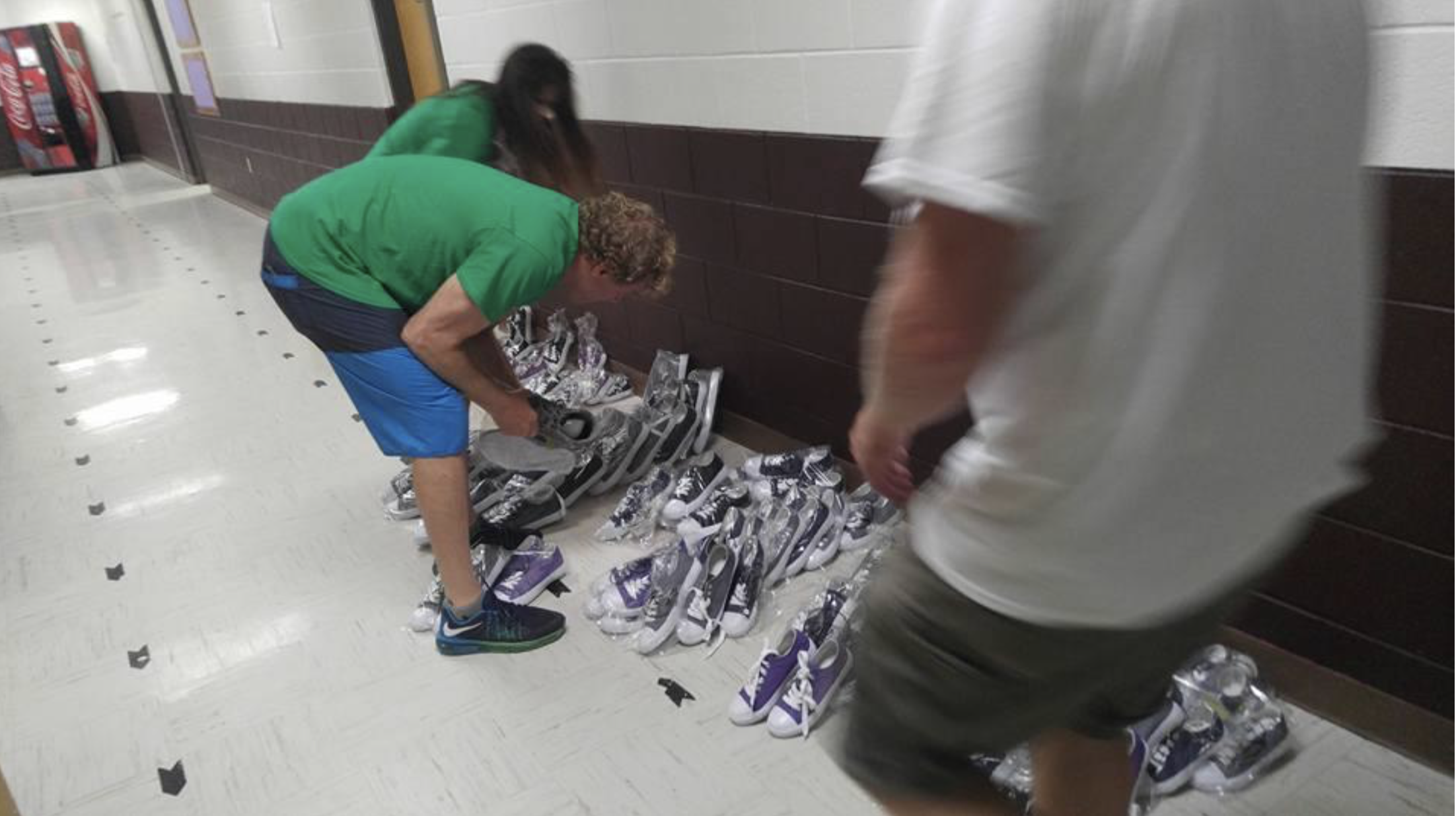 Billy Lerner helping to distribute Billy4kids shoes