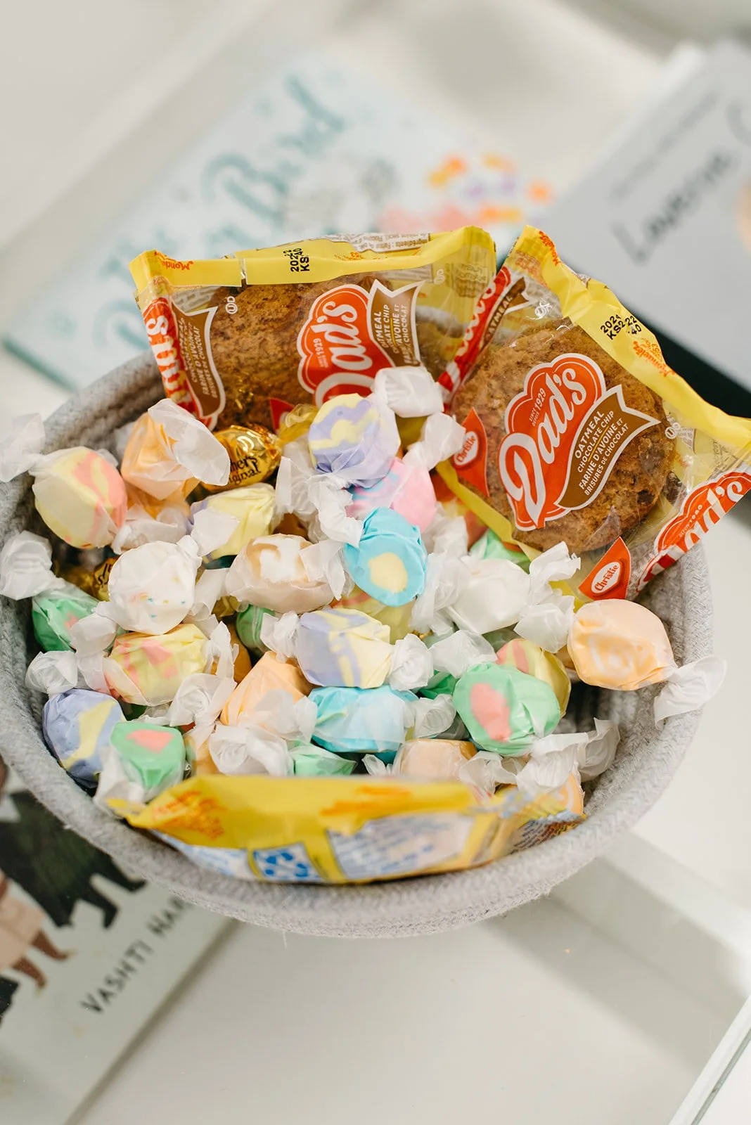 Digital photograph of a bowl of saltwater taffy and oatmeal chocolate chip cookies