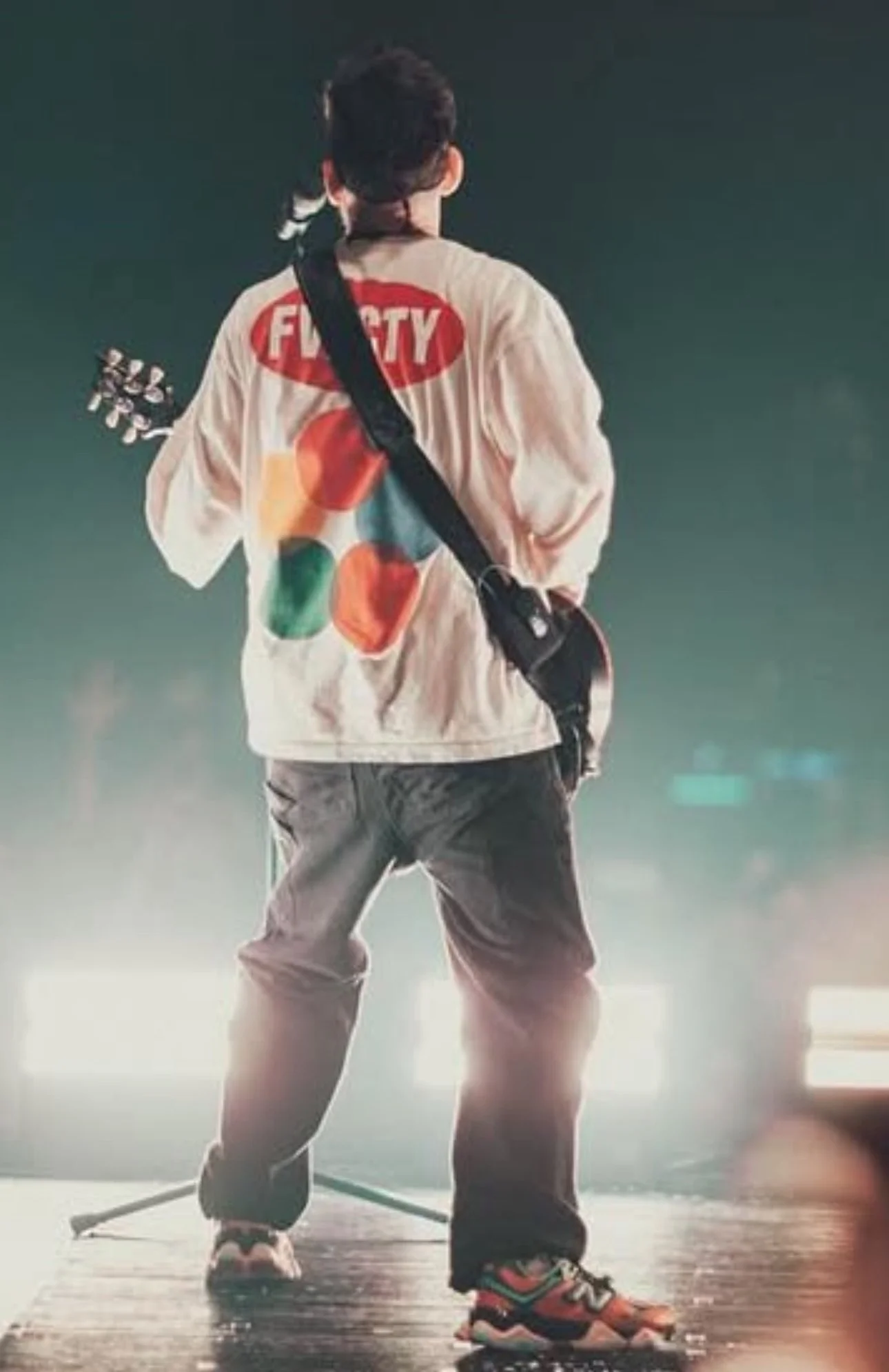Mike Shinoda wearing Favor City Frylon Long Sleeve on tour, side view