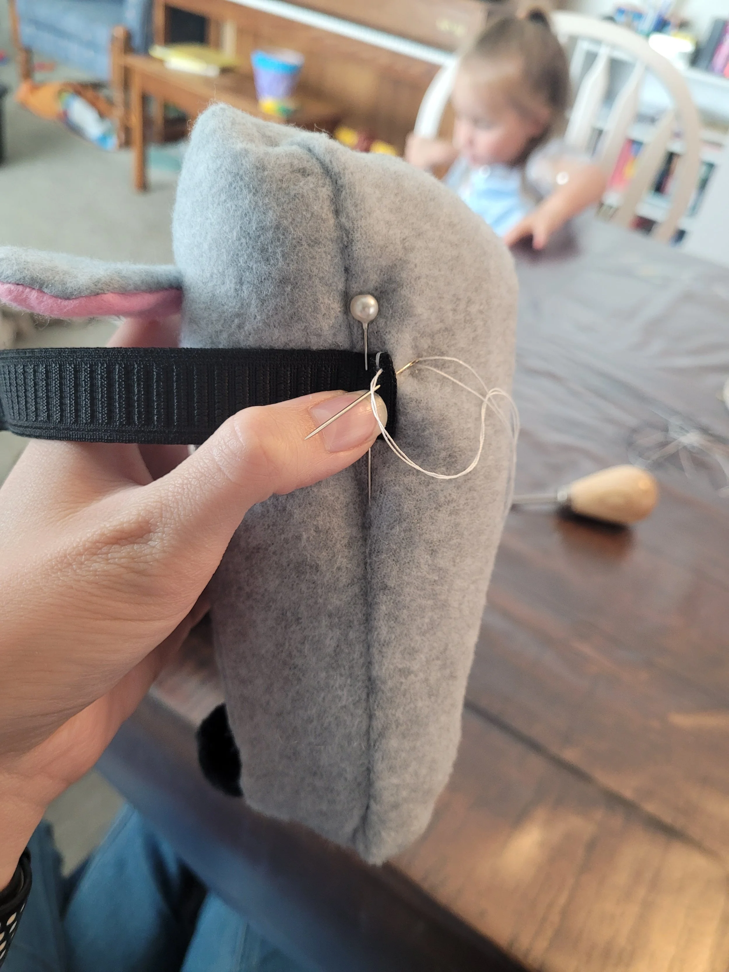 Attaching the elastic for the foot.