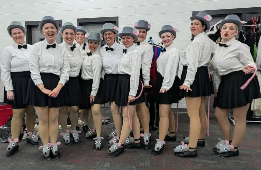 The rat tappers showing off their costumes backstage.