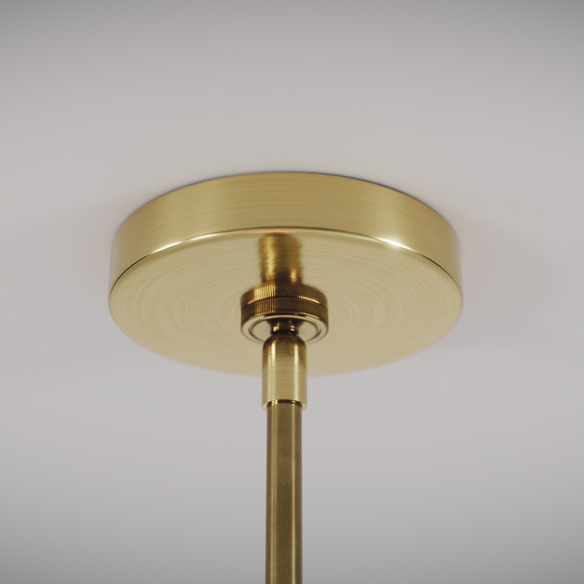 closeup view of a modern design ceiling lamp with a warm light on in a white studio environment