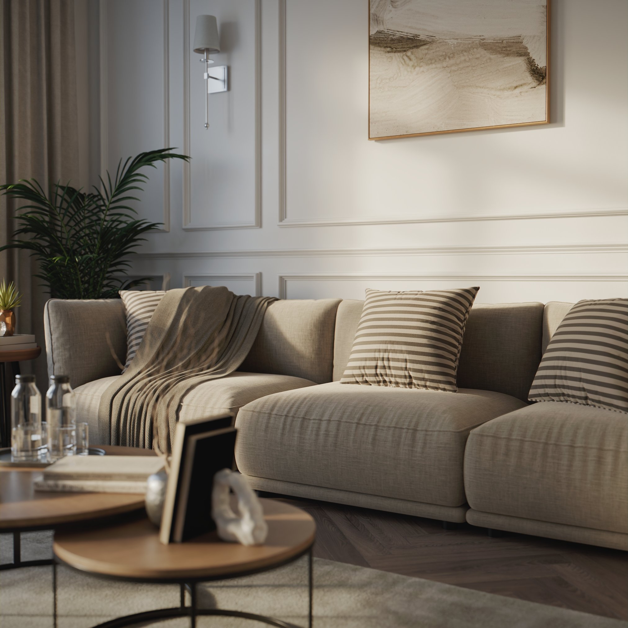 partial view of the same room where we can see the nested coffee table sin the foreground and the sofa and plant in the bakground