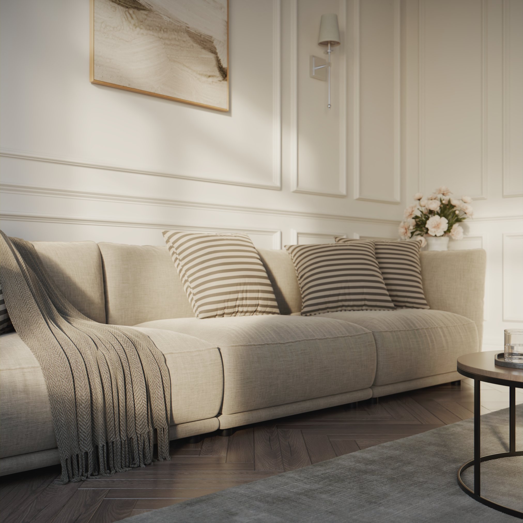 a wider view of the sofa where we can see the white vase with roses on the corner