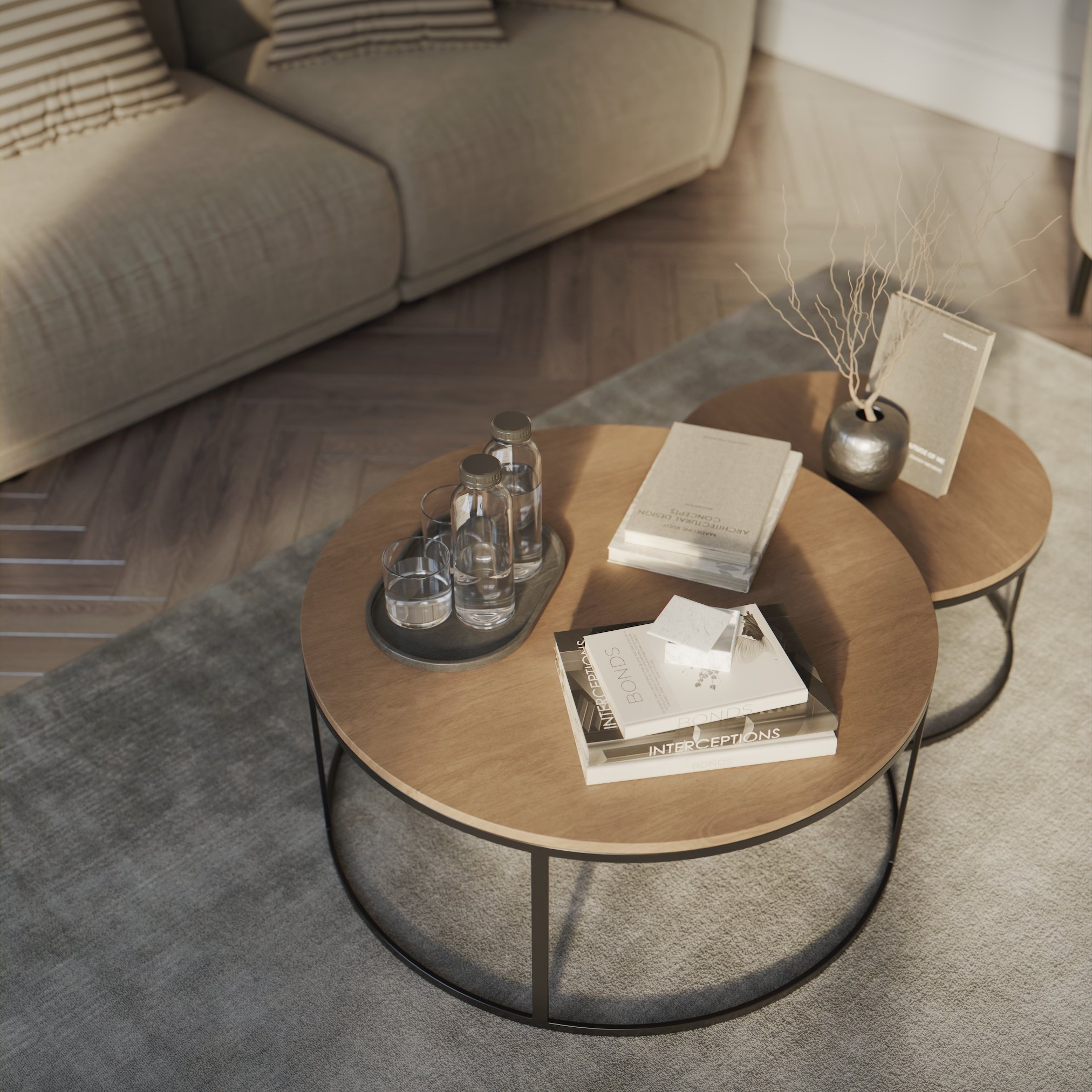top view of a nested coffee tables with books and some other objects