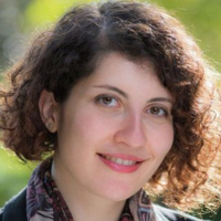 Peyvand smiling. Sun hitting hair, Close up headshot