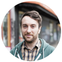 Kyle smiling. Building in background