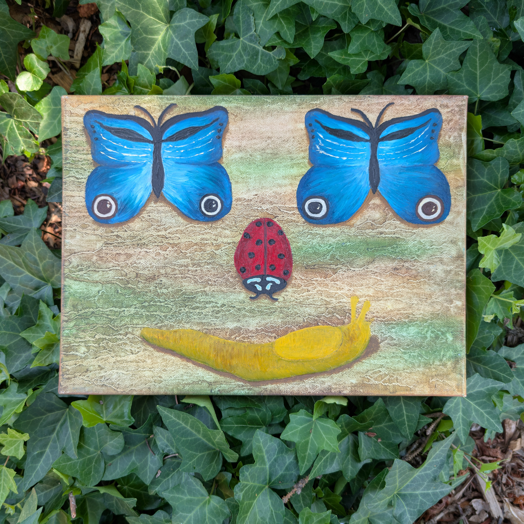 A painting of a smiling face made with various insects and insects-inspired elements. The eyes are blue butterflies, the nose is a red ladybug, and the mouth is a yellow banana.