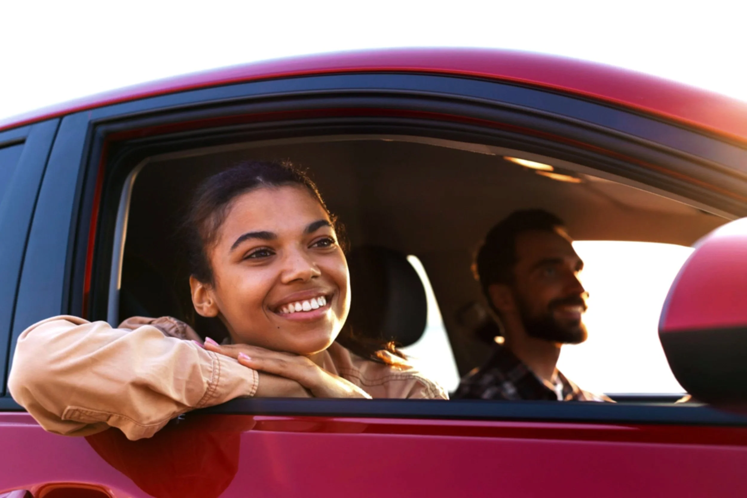 smiley-couple-traveling-by-car.jpg