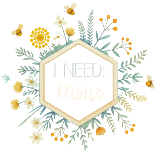 Hexagon-shaped sign with the words "NEED More" surrounded by flowers, leaves, and bees.