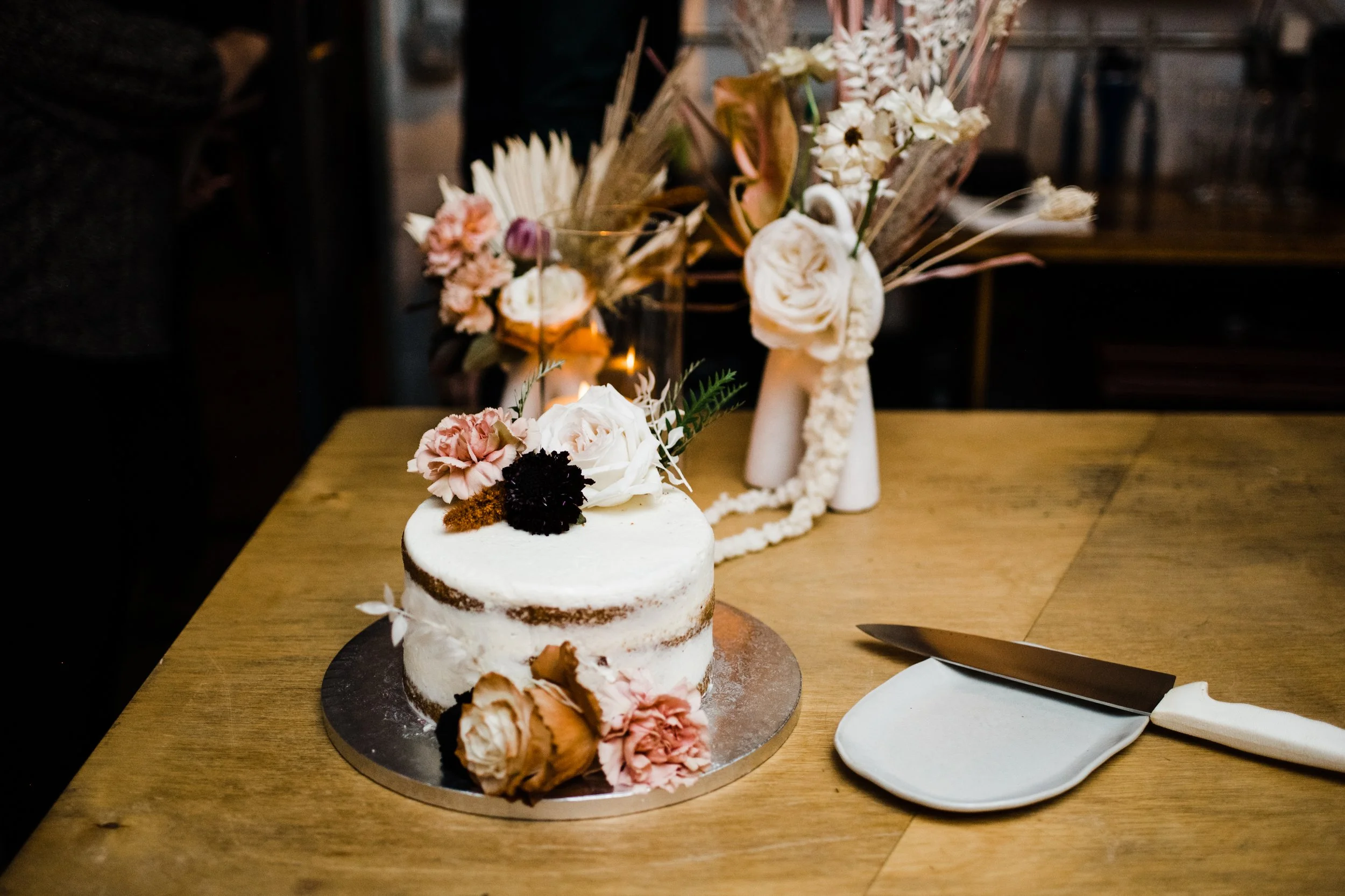 naked cake decorated with fresh flowers