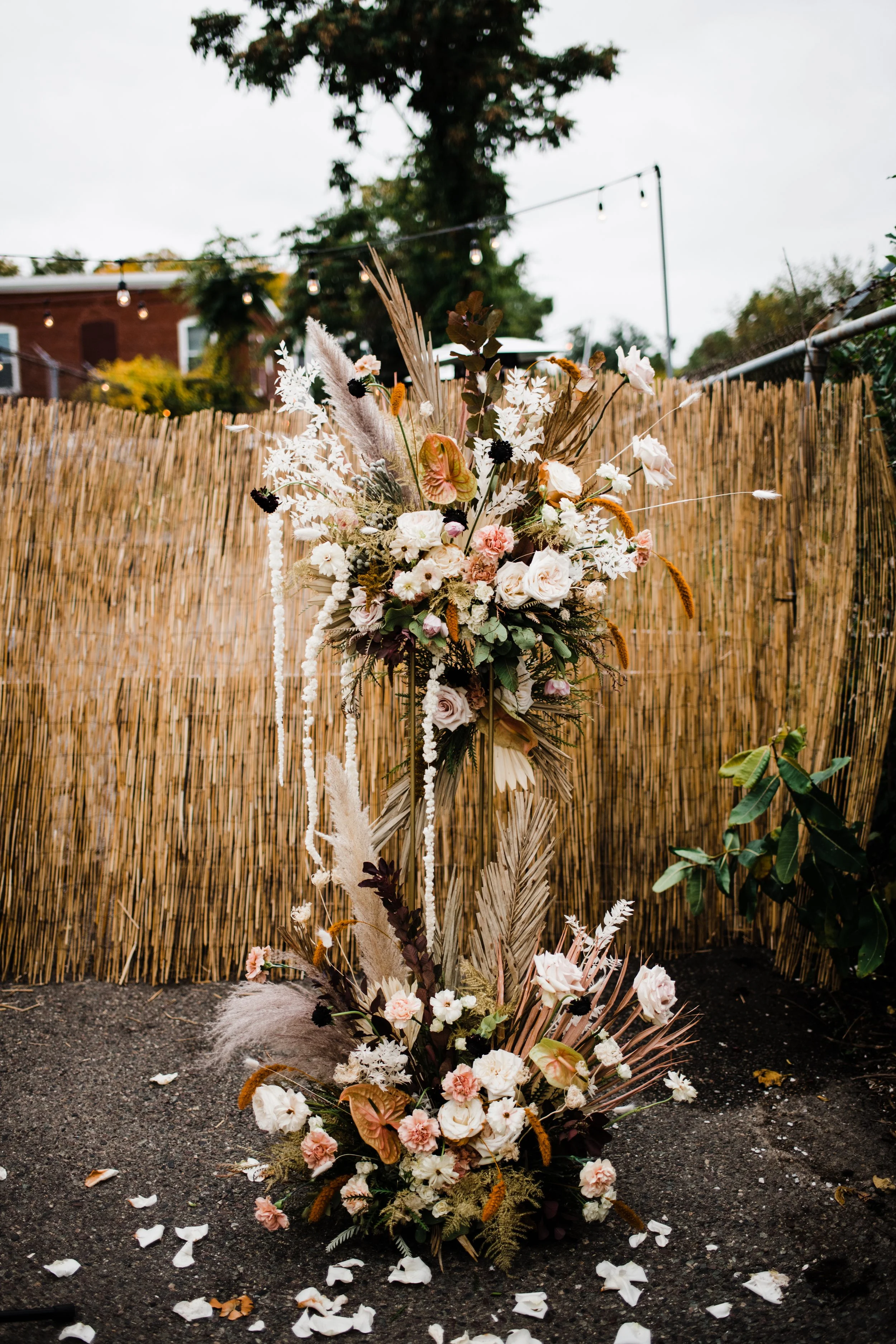 floral arrangement on a stand at wedding alter