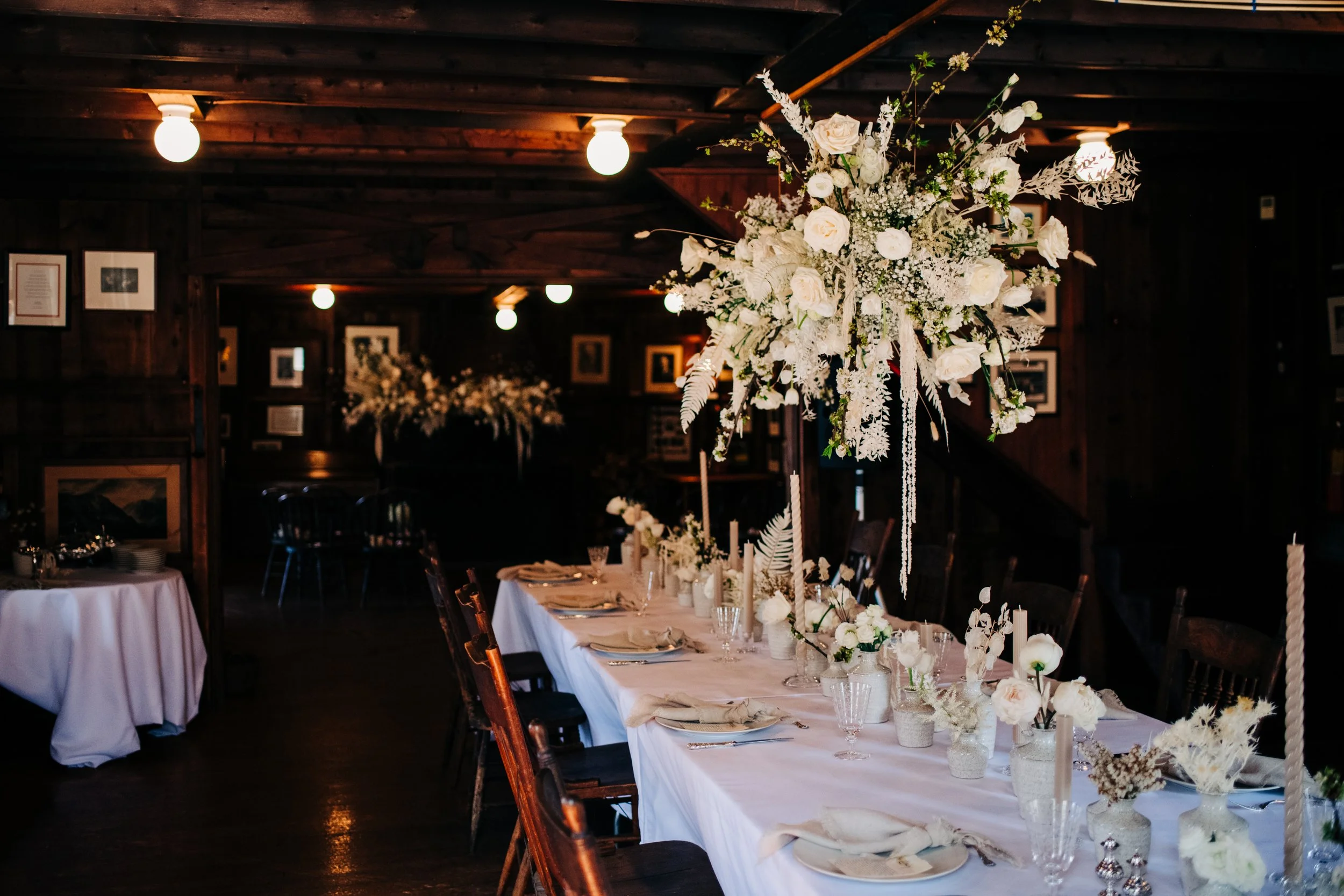 dining table decorated with white floral centerpieces