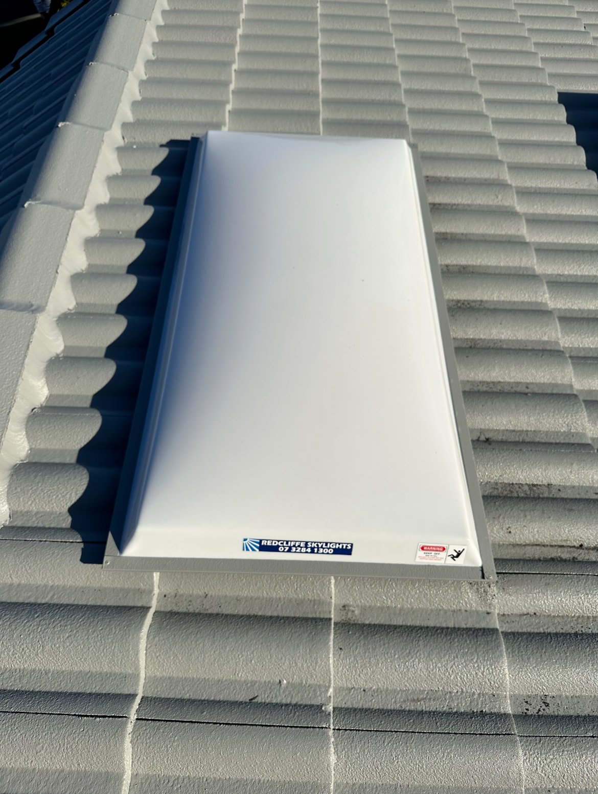 A skylight installed on a metal roof.