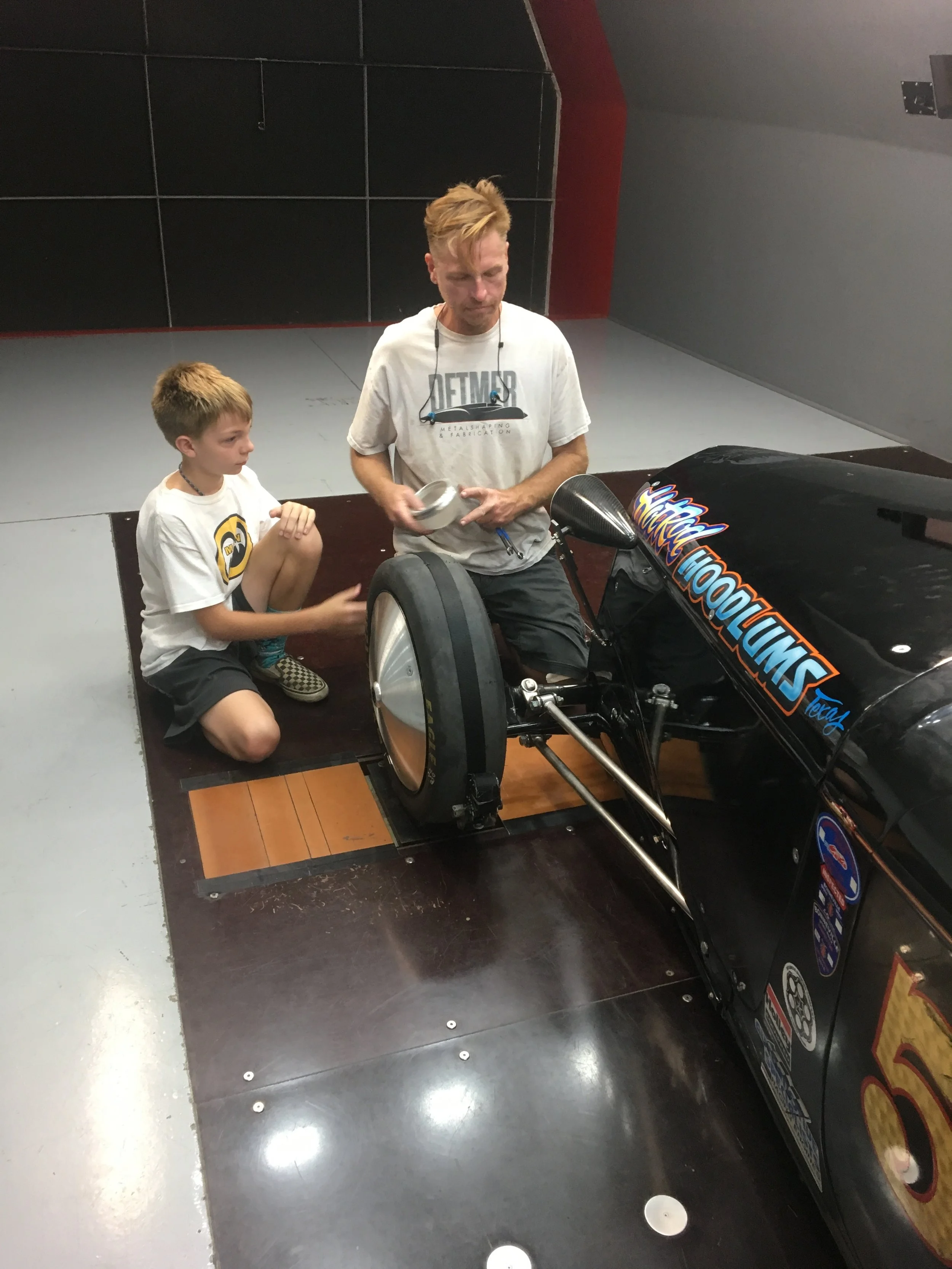 Damon Detmer and son working on Bonneville car