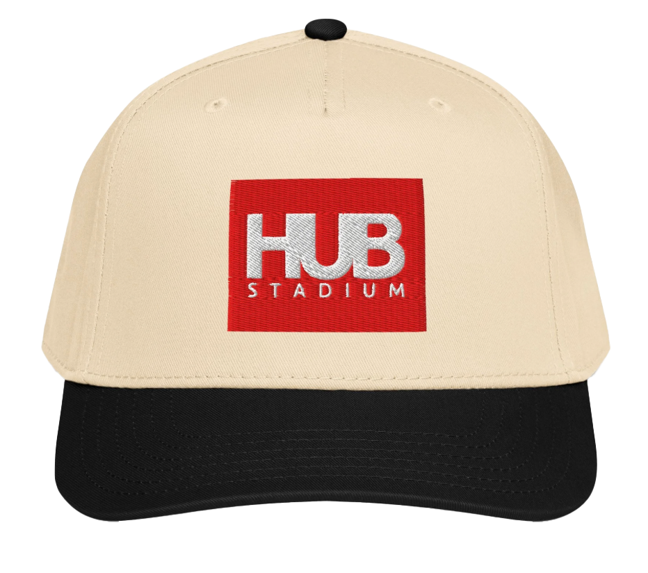 Baseball cap with a beige crown, black brim, and a red square patch with white embroidery reading "HUB STADIUM."