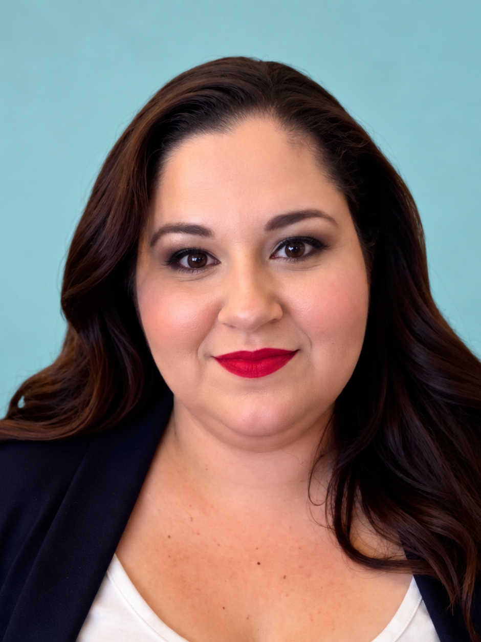 Headshot of Jenn Booker, LMHC, counselor with The Inner Compass Collective