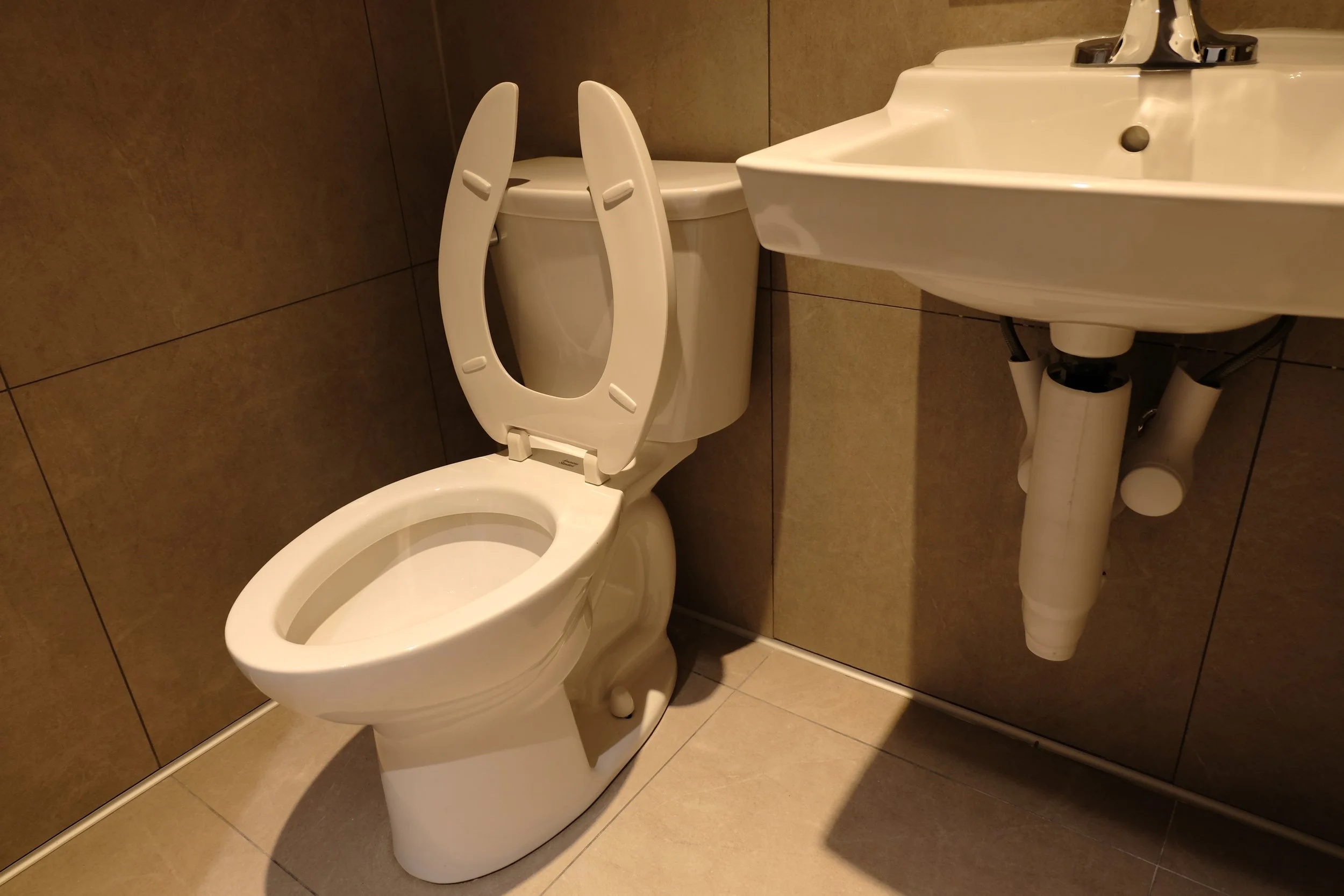 COMMERCIAL AMERICAN STANDARD TOILET ROUGH-IN AND FINISH WORK AT ORANGETHEORY FITNESS, MISSISSAUGA, ON