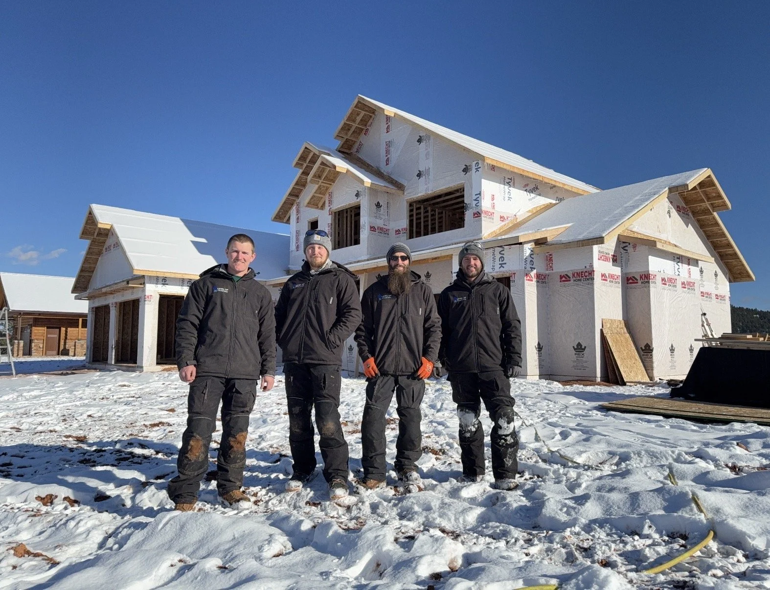 Framing Crew in front of newly built home