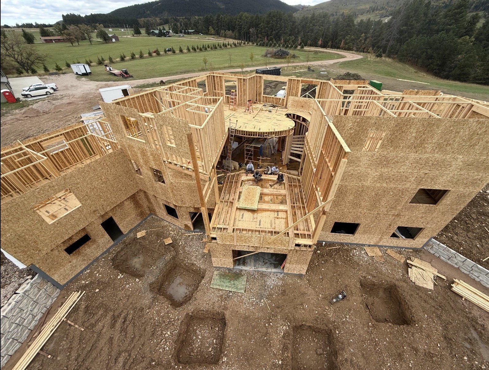 Large custom built home in the process of being framed