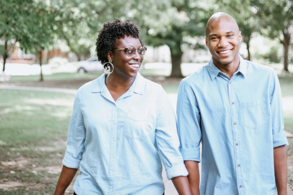 Black couple holding hands in park in Kalamazoo Michigan