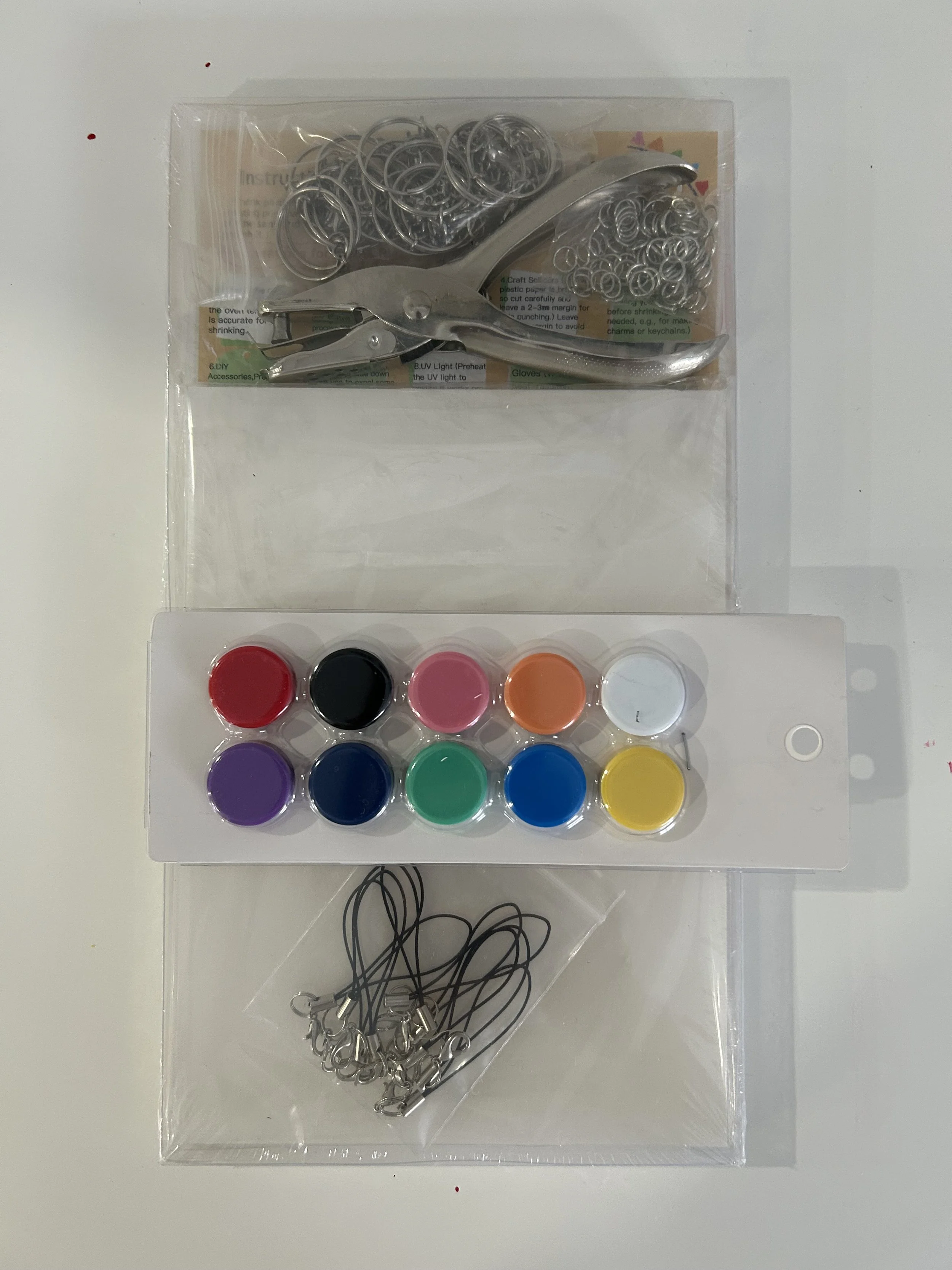 Supplies required for a shrinky dink magnet project to complete with your family at home.