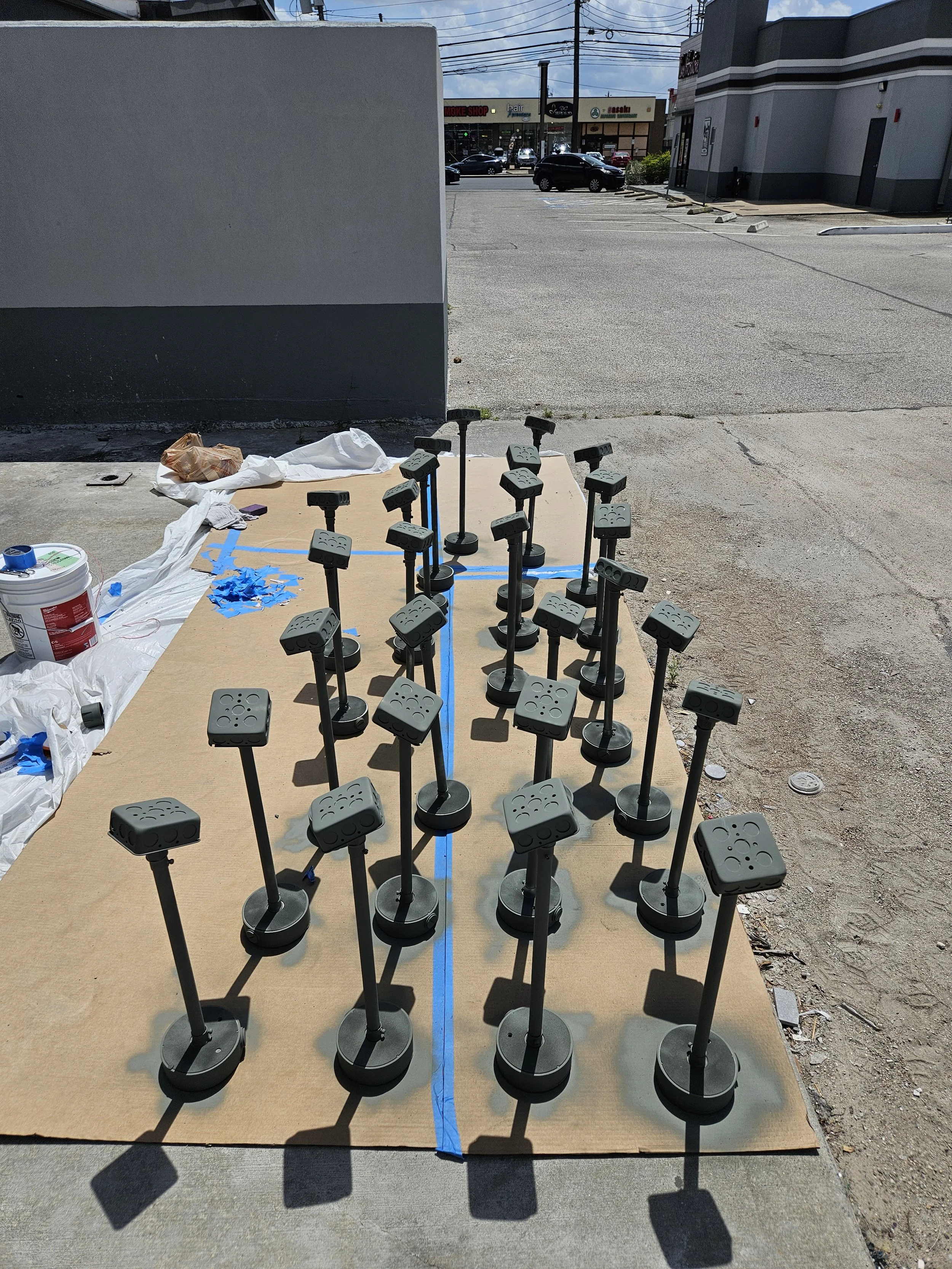 Custom camera mounting assemblies prepped and painted for a clean, uniform finish before installation.