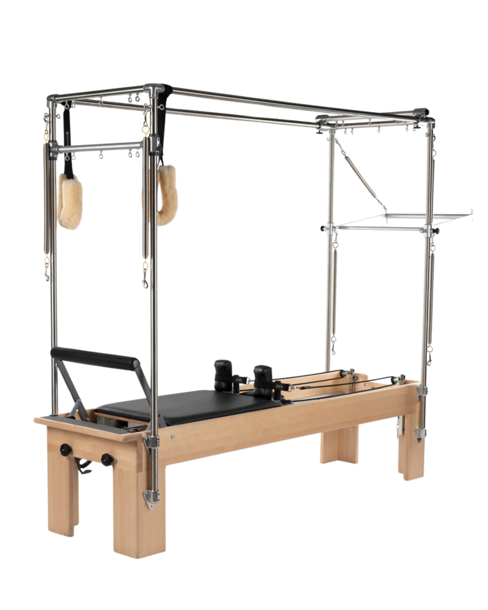 Balanced Body reformer and Cadillac unit used at FLO PILATES Palo Alto, featuring wooden frame, padded carriage, and resistance springs for small-group Pilates training.