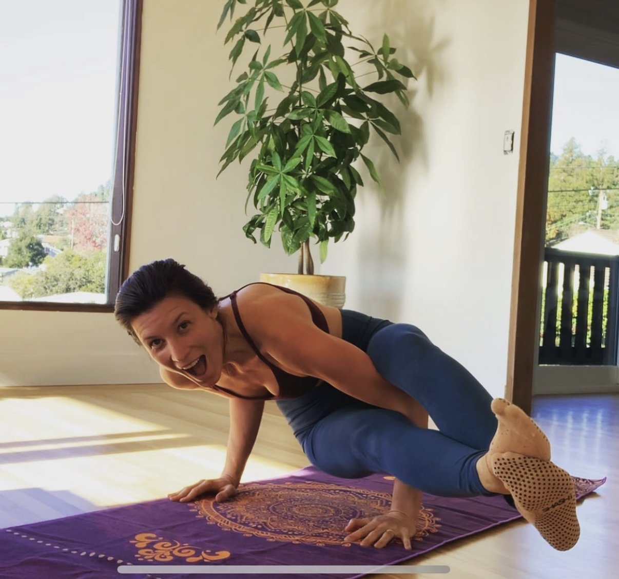 gabie wove health founder doing arm balancing yoga pose