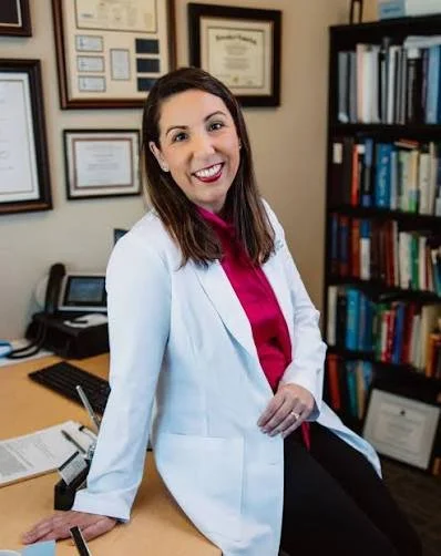 Dr Carolina Sueldo, IVF specialist sitting in her office