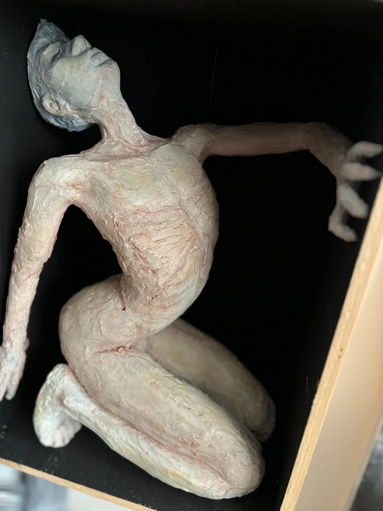 MAN IN A BOX No.3 14h x 10w x 7d in. paper mâché, plaster, joint compound, glue, dry pigment and shoe polish in an upcycled wine crate