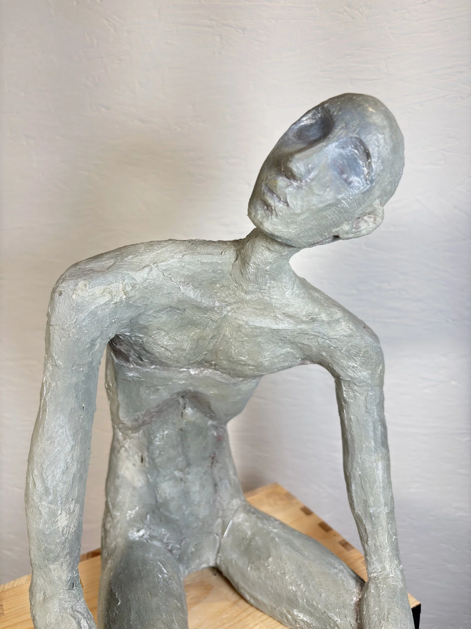 MAN ON A BOX 27h x 10w x 11d in. paper mâché, plaster, joint compound, glue, dry pigment and shoe polish on an upcycled wine crate