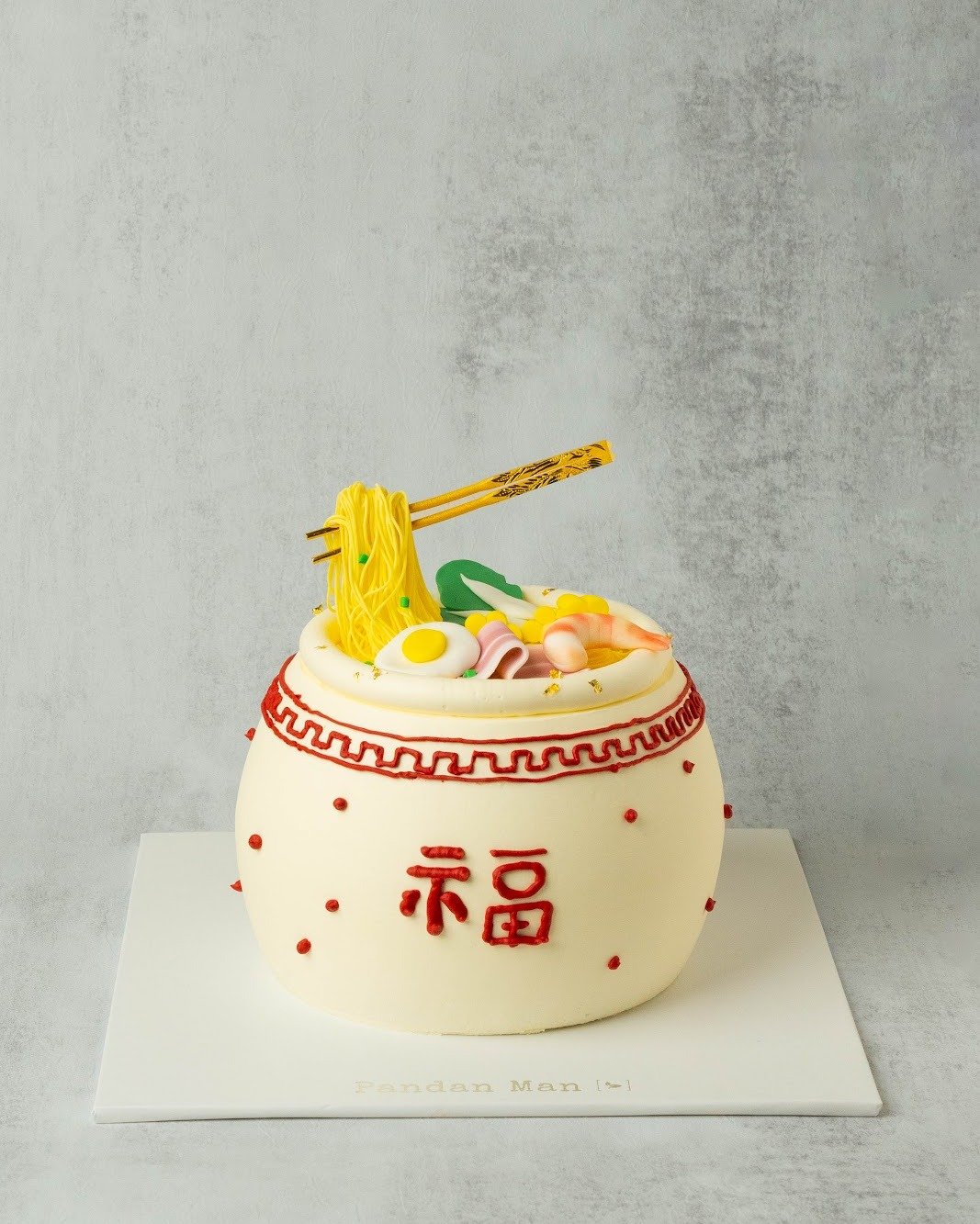 When it comes to Mother&rsquo;s Day, why settle for anything less than a showstopper?

This year, surprise mom with not one, but two cakes that are sure to wow. The Long-Life Noodle Cake is a gift of prosperity, and the Drapey Ribbon Cake is an elega