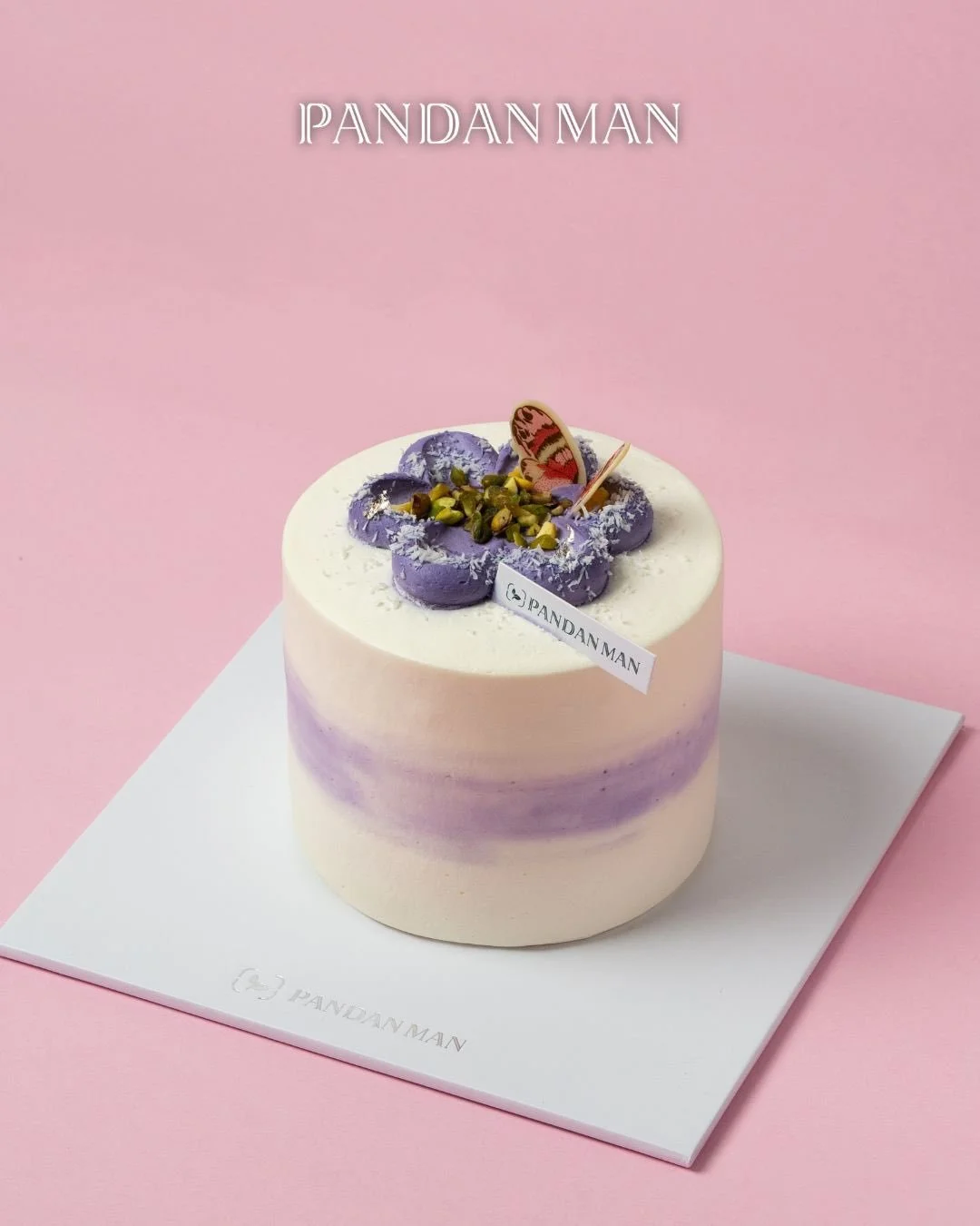 Pandan on the outside, Dajia Taro in the heart of it. The Taro Pandan Cake is all about contrast: soft, rich layers that unfold slowly with every bite. 🍰💜 

A beautiful butterfly made of chocolate gently &ldquo;kissing&rdquo; the cake&mdash;perfect