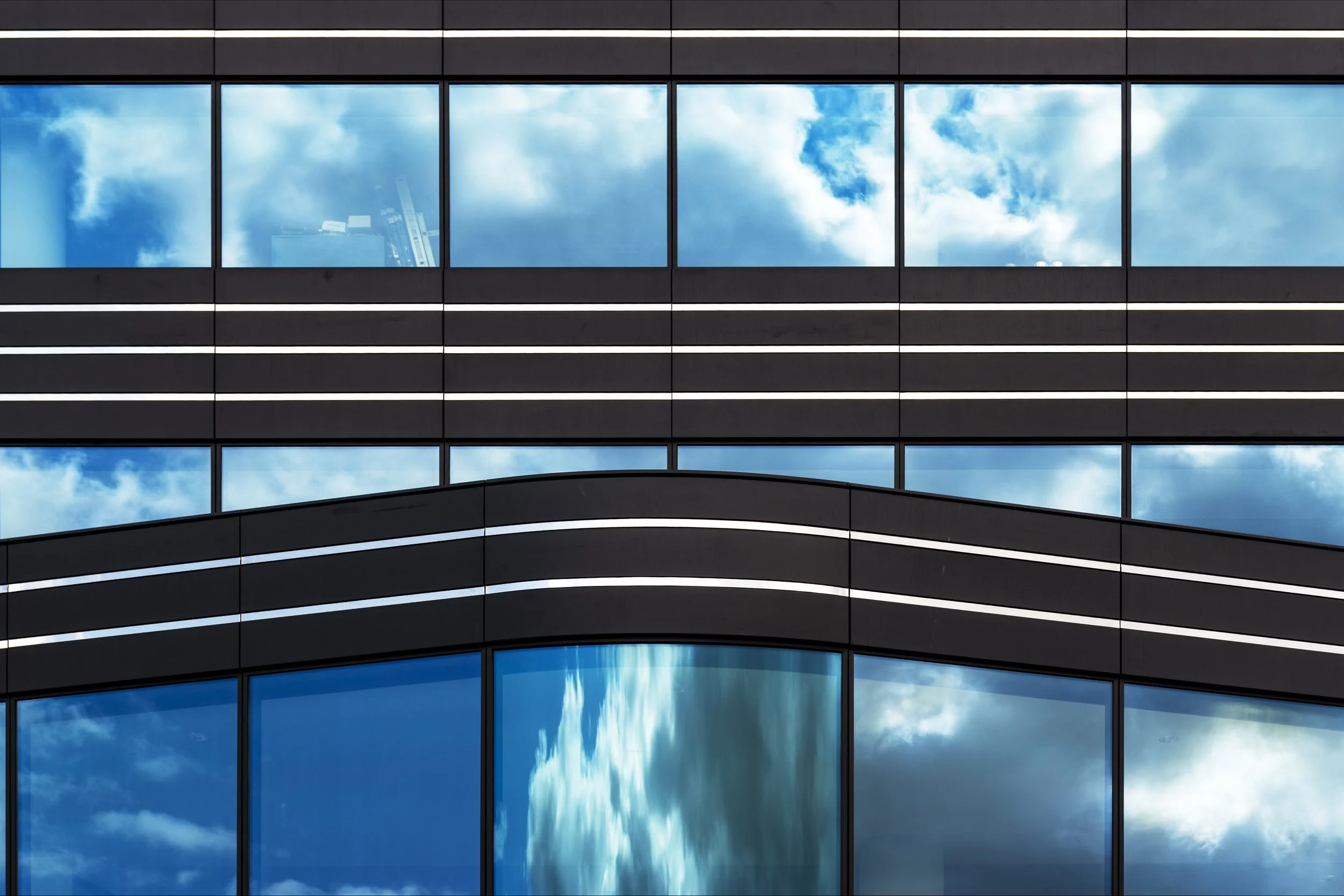 modern-building-with-glass-windows-silently-witnessing-life-big-city.jpg