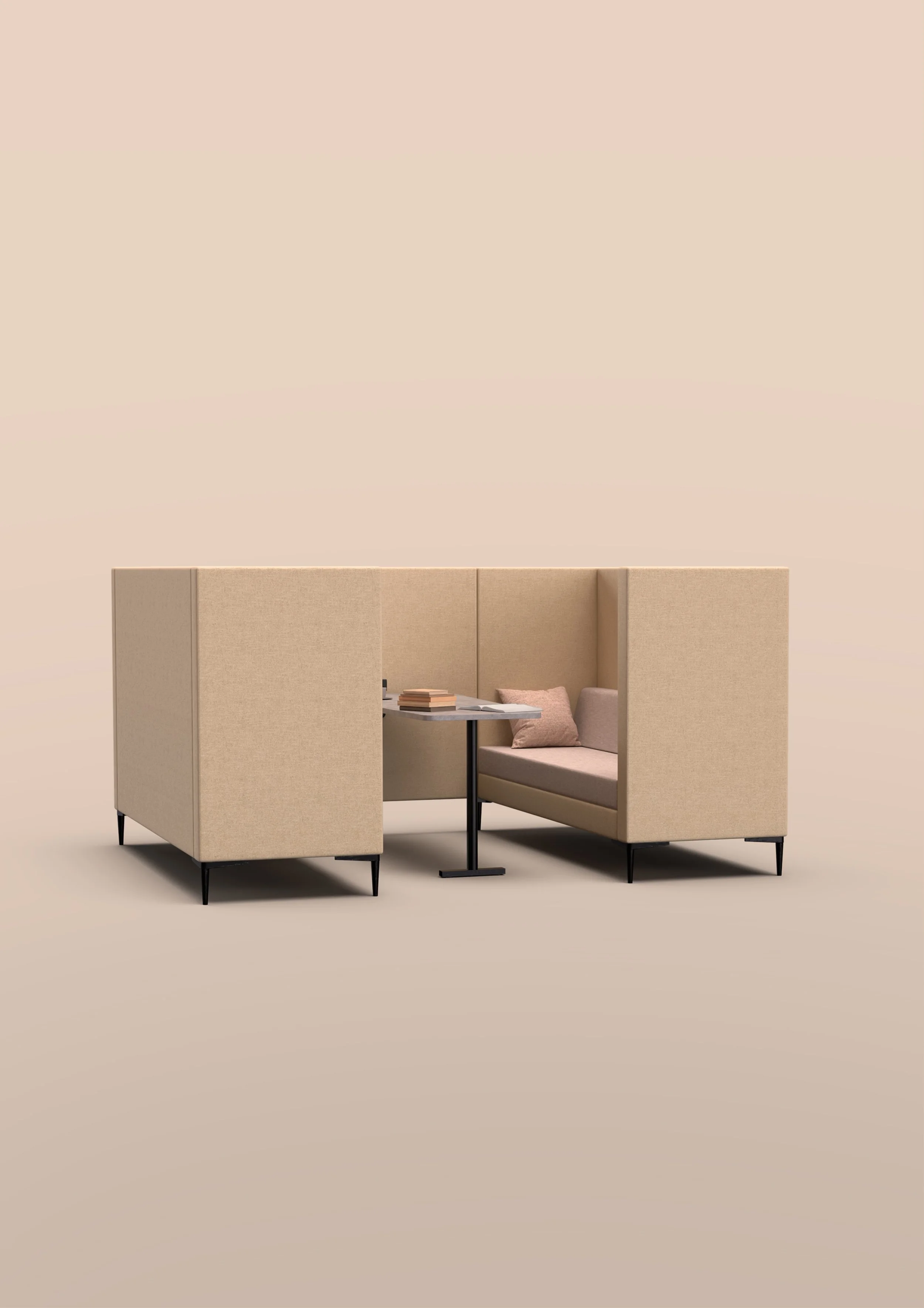 A beige Element booth with cushioned seating, a small round table with a stack of books, and a light pink pillow, set against a plain beige background.