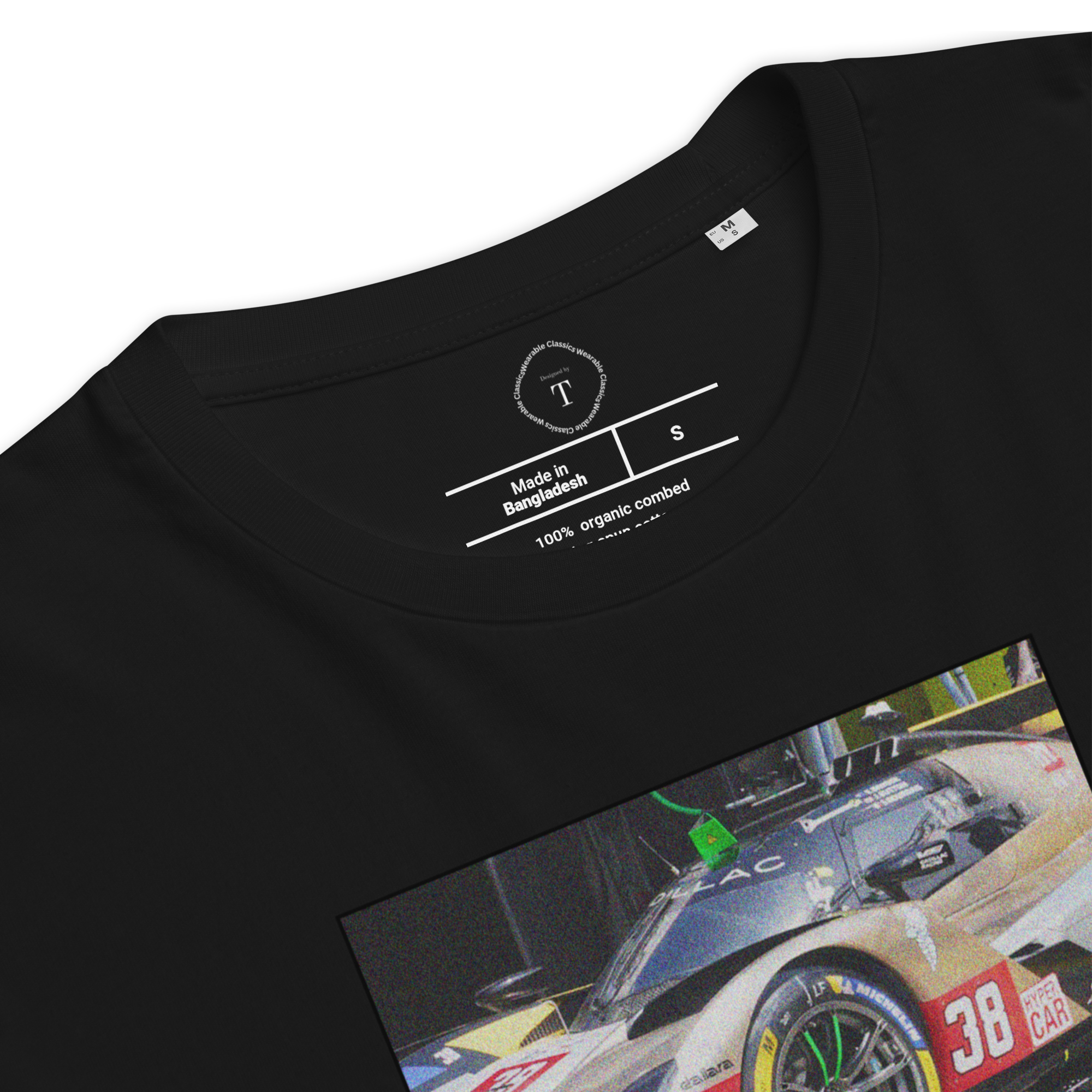 Black Unisex Cotton T-Shirt folded close up with sqaure box design with photographs of Cadillac Racing from multiple angles at Le Mans