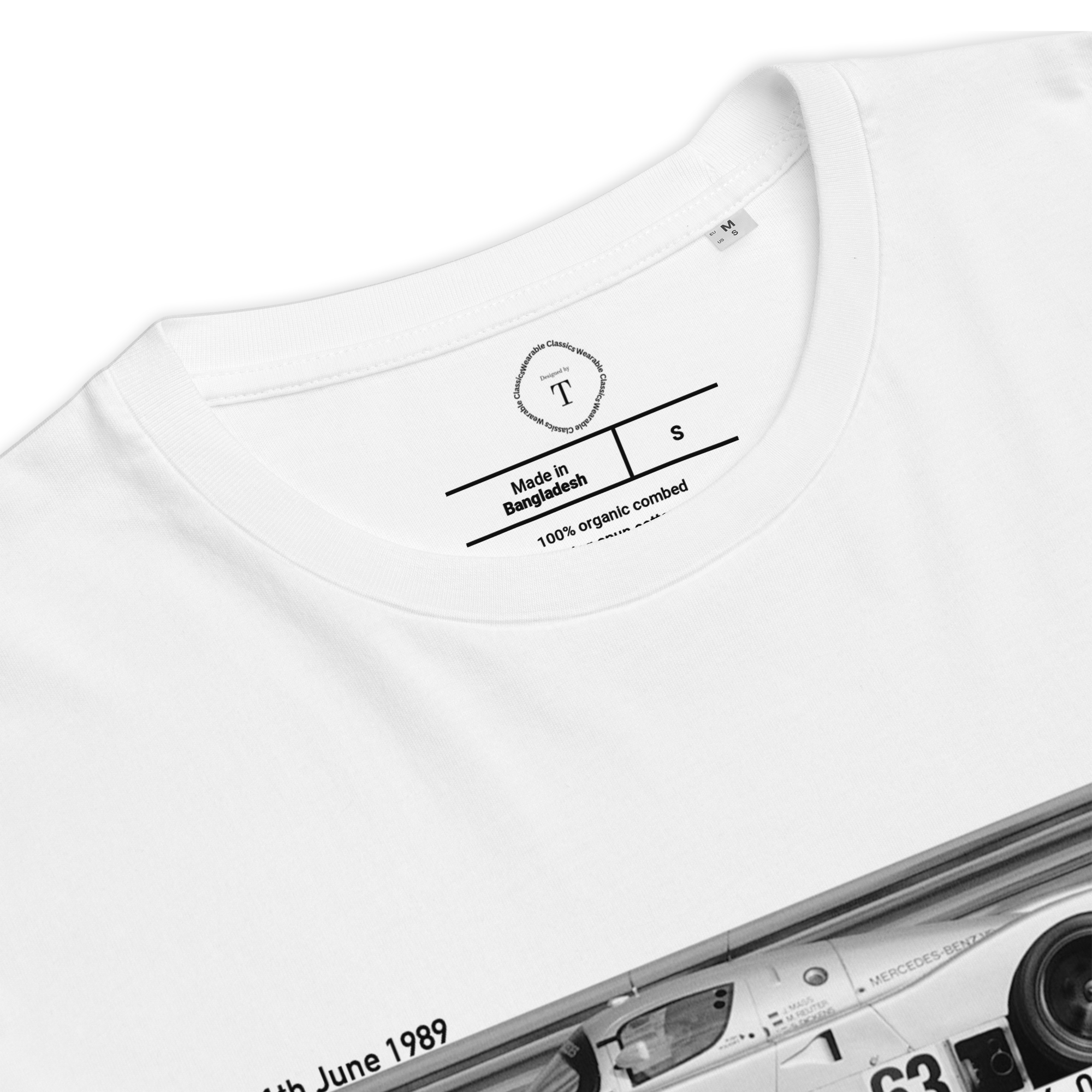 White Unisex Cotton T-Shirt folded close up with banner image of Mercedes C9 1989 at Le Mans in the centre with text of coordinates and date of race