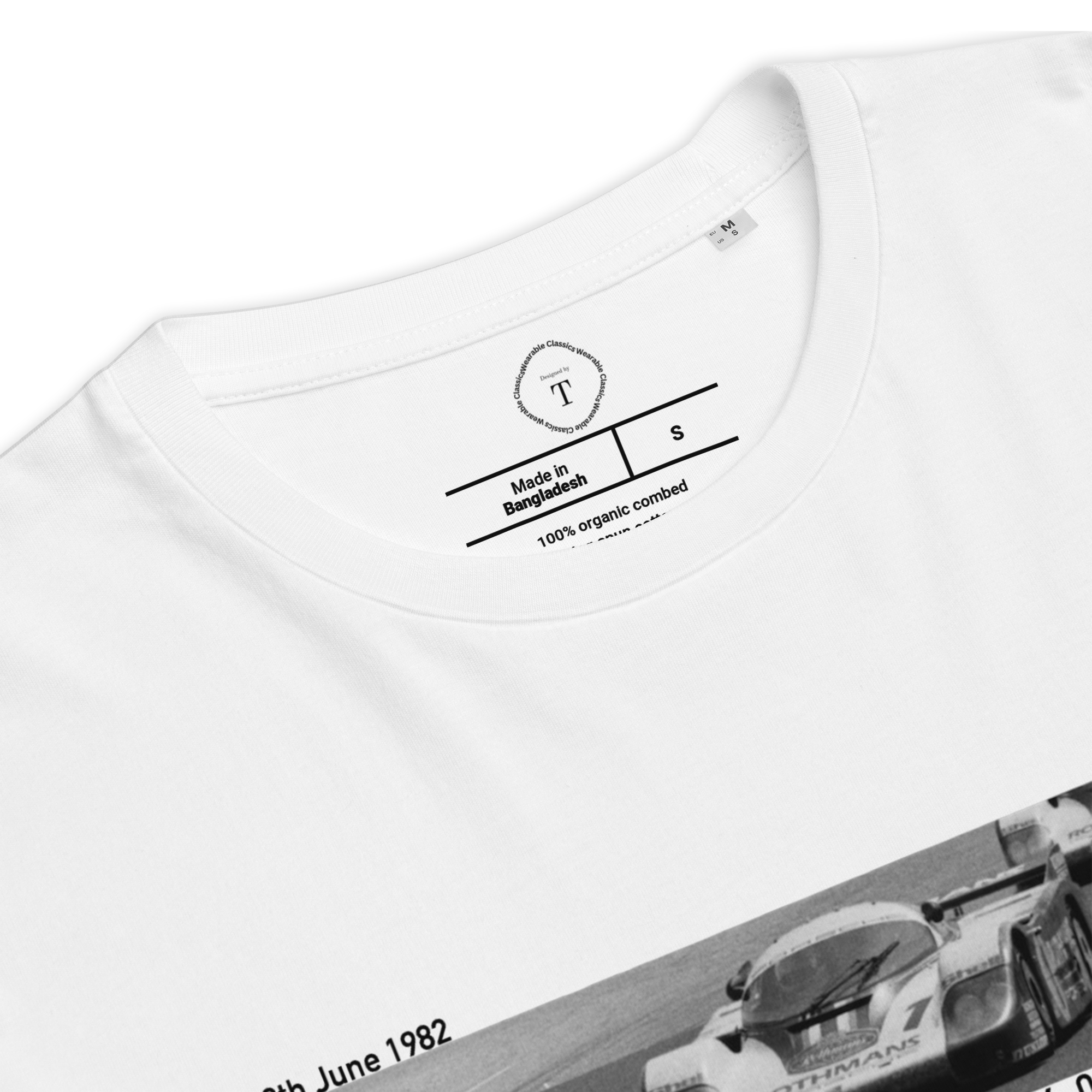 White Unisex Cotton T-Shirt folded close up with banner image of Porsche 1982 at Le Mans in the centre with text of coordinates and date of race