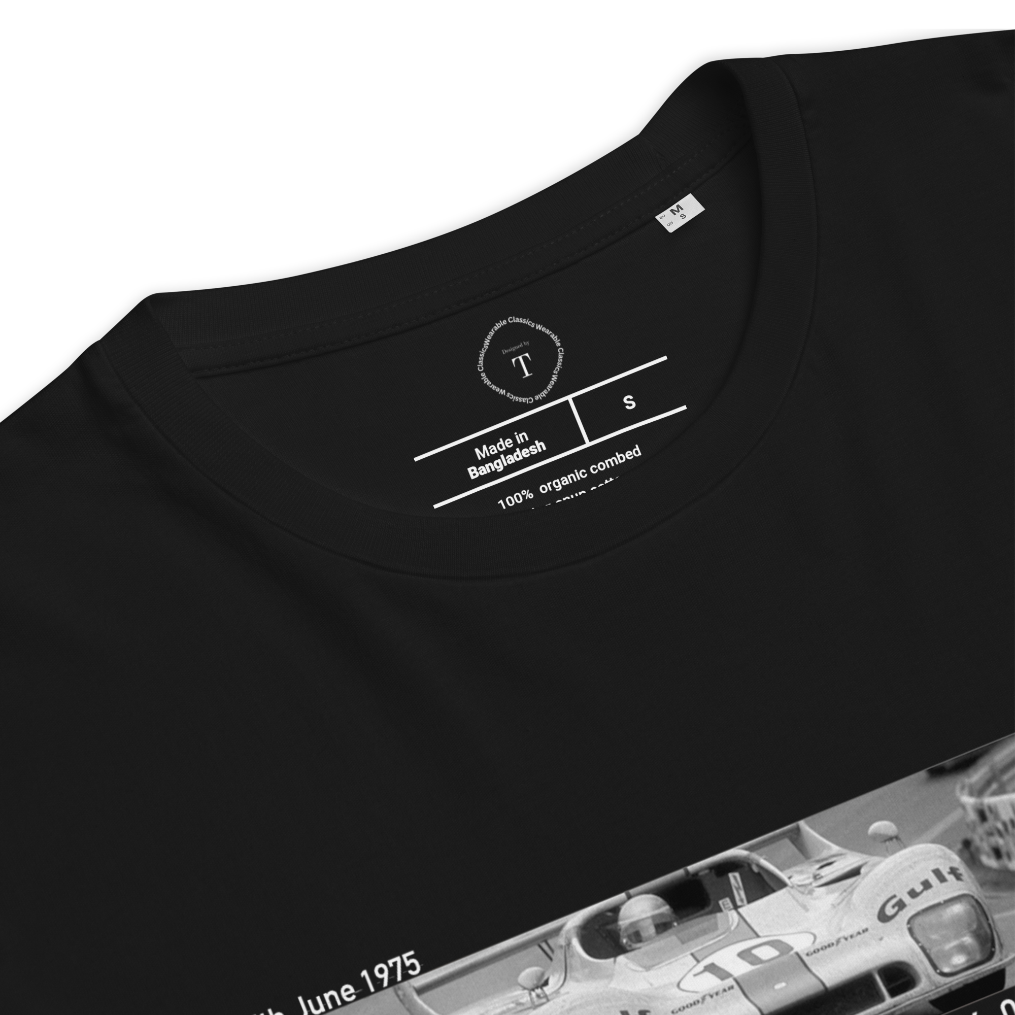 Black Unisex Cotton T-Shirt folded close up with banner image of Ford 1975 at Le Mans in the centre with text of coordinates and date of race