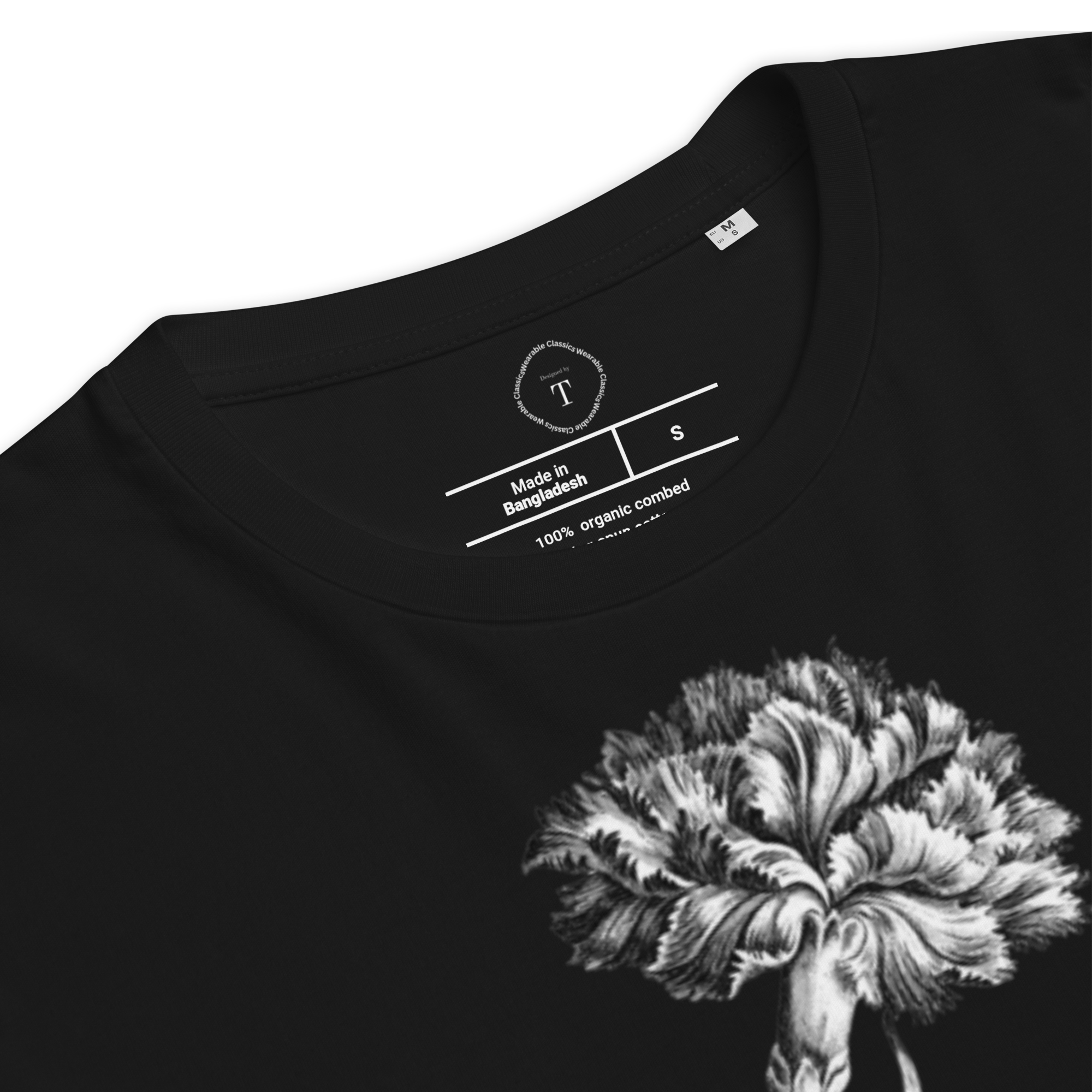 Black Unisex Cotton T-Shirt folded close up with black and white image of carnation flower in the centre