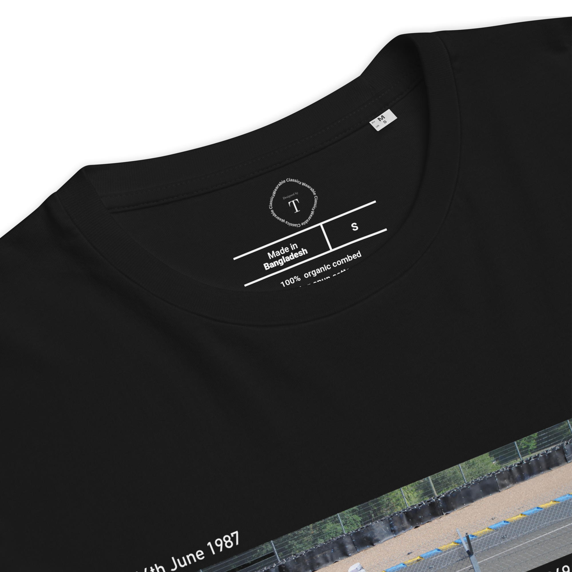 Black Unisex Cotton T-Shirt folded close up with banner image of Jaguar XJR-9 at Le Mans in the centre with text of coordinates and date of race