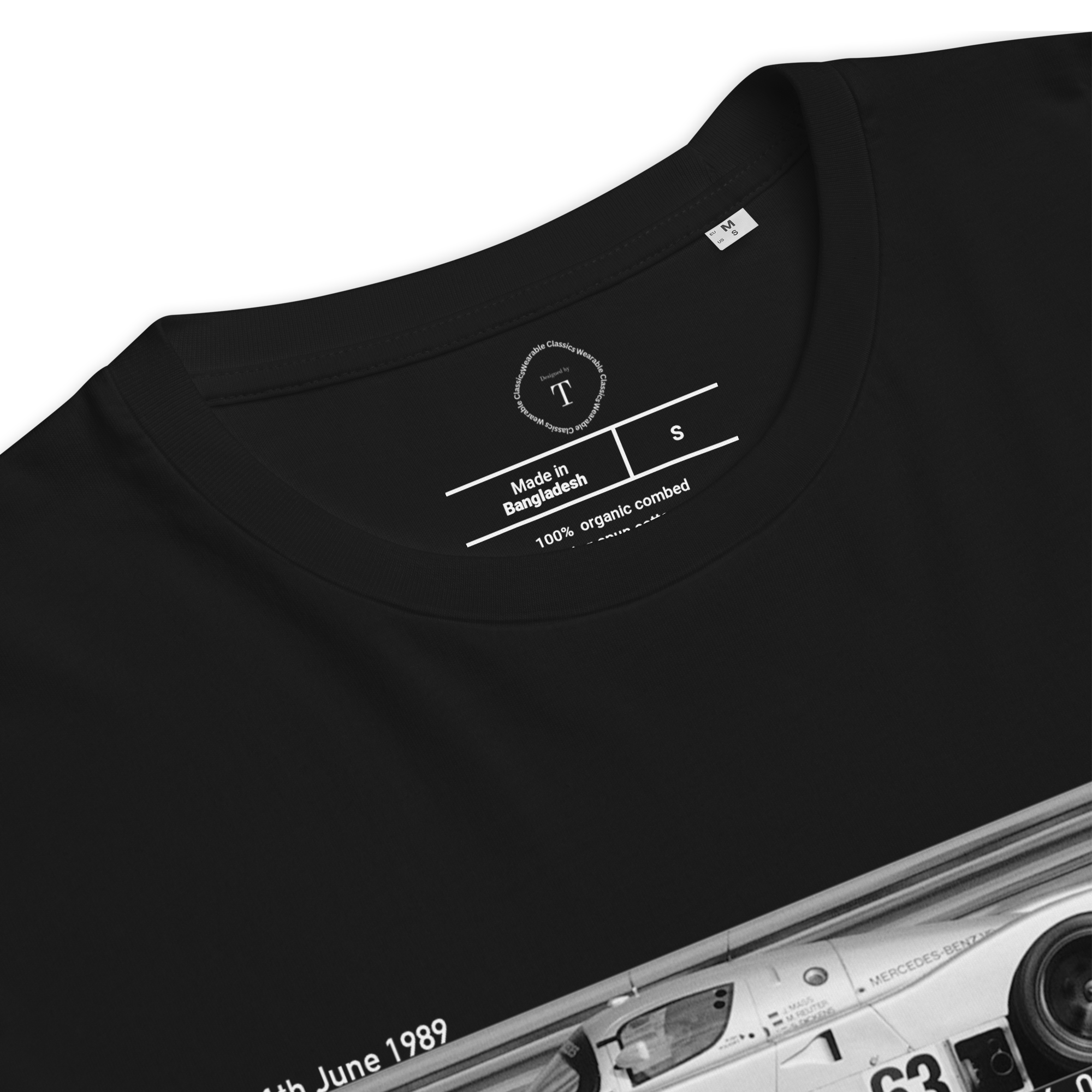 Black Unisex Cotton T-Shirt folded close up with banner image of Mercedes C9 1989 at Le Mans in the centre with text of coordinates and date of race
