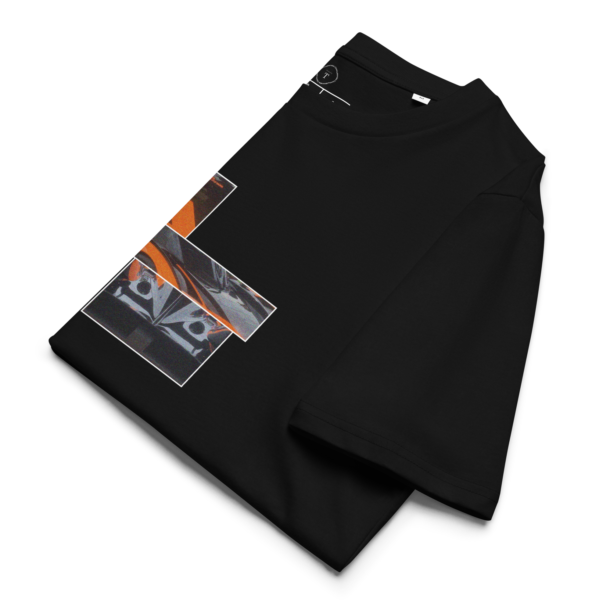 Black Unisex Cotton T-Shirt folded close up with sqaure box design with photographs of McLaren Racing from multiple angles at Le Mans