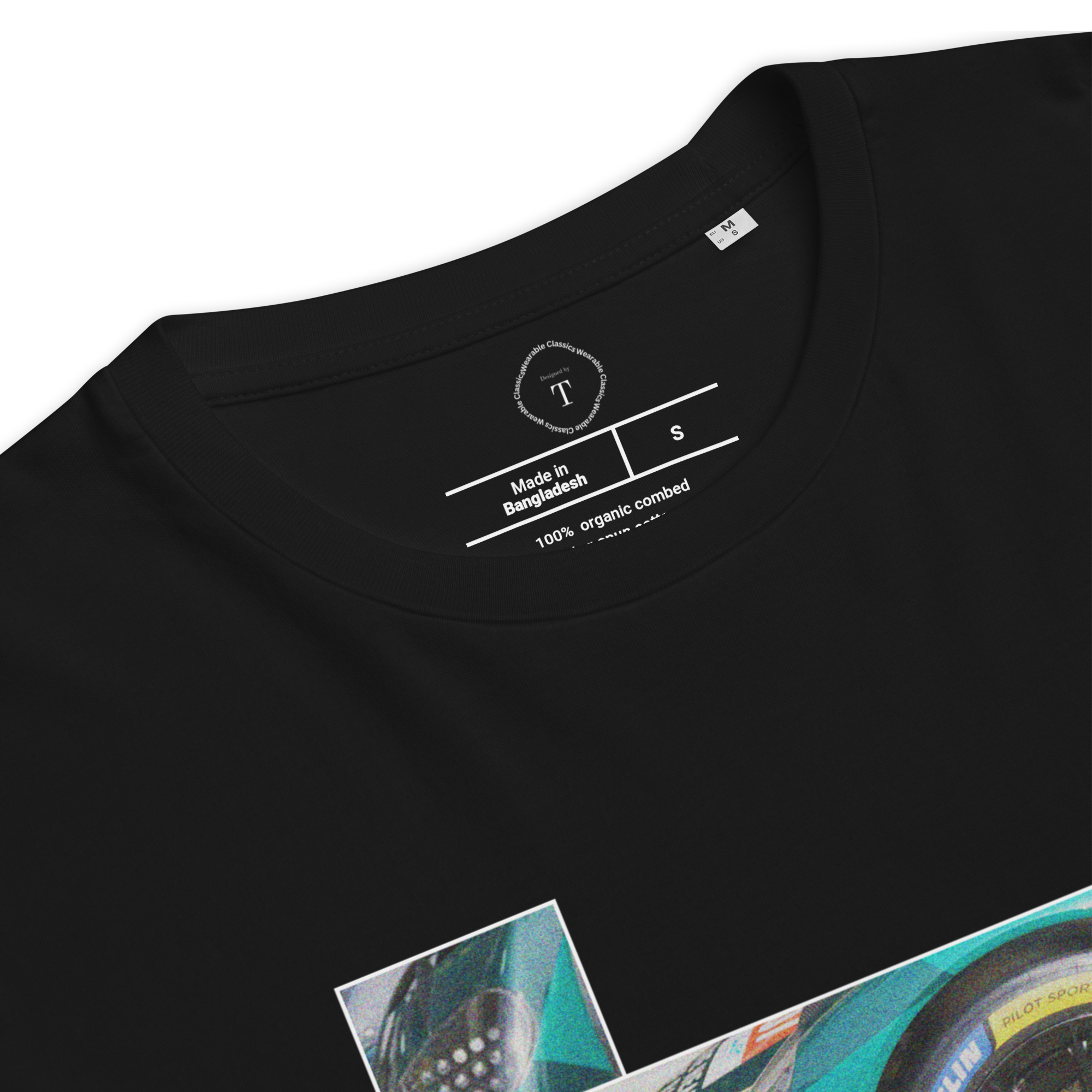 Black Unisex Cotton T-Shirt folded close up with sqaure box design with photographs of Aston Martin from multiple angles at Le Mans